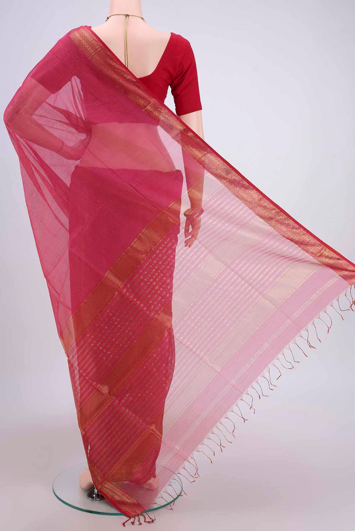 Flat view of Dark Pink Maheshwari Silk Cotton Saree with Stripes on the body and Zari Border. 
