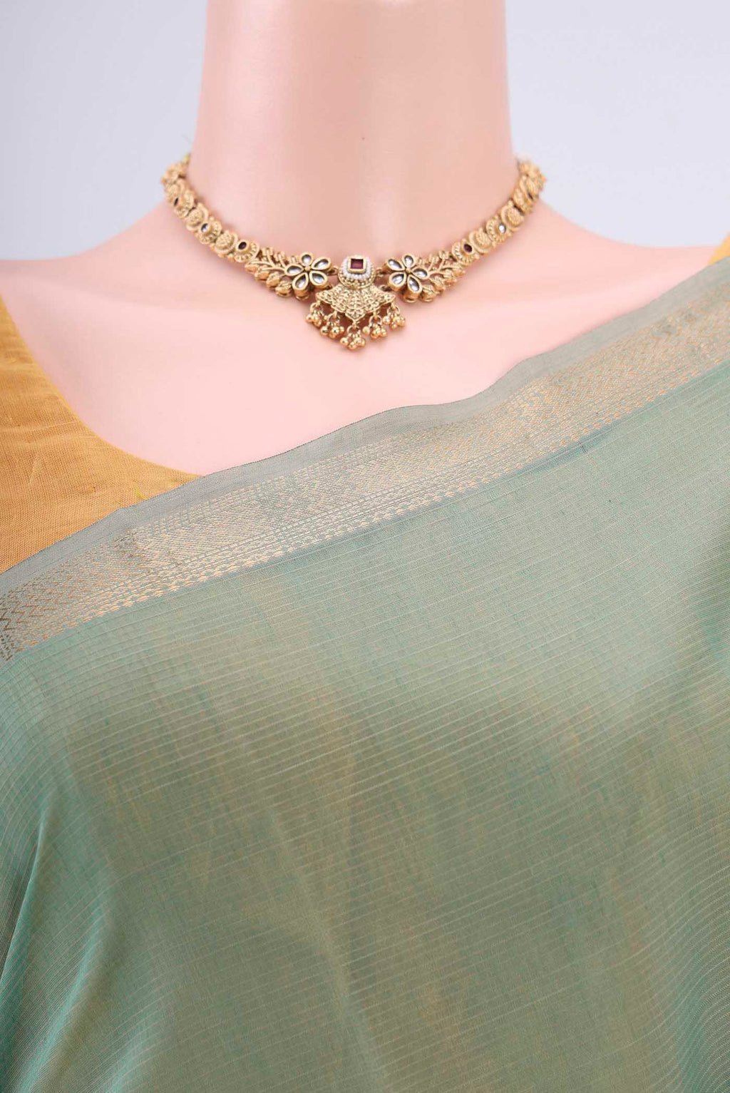 Border image of Sage Green Maheshwari Silk Cotton Saree with Stripes on the body and Zari Border. 