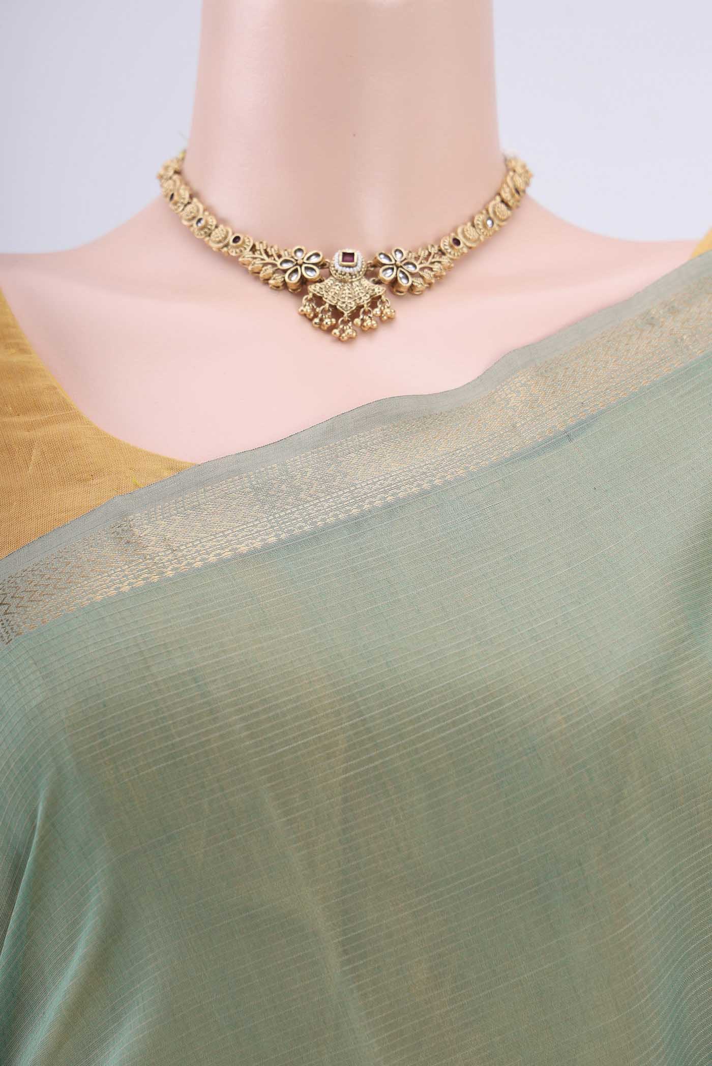 Border image of Sage Green Maheshwari Silk Cotton Saree with Stripes on the body and Zari Border. 