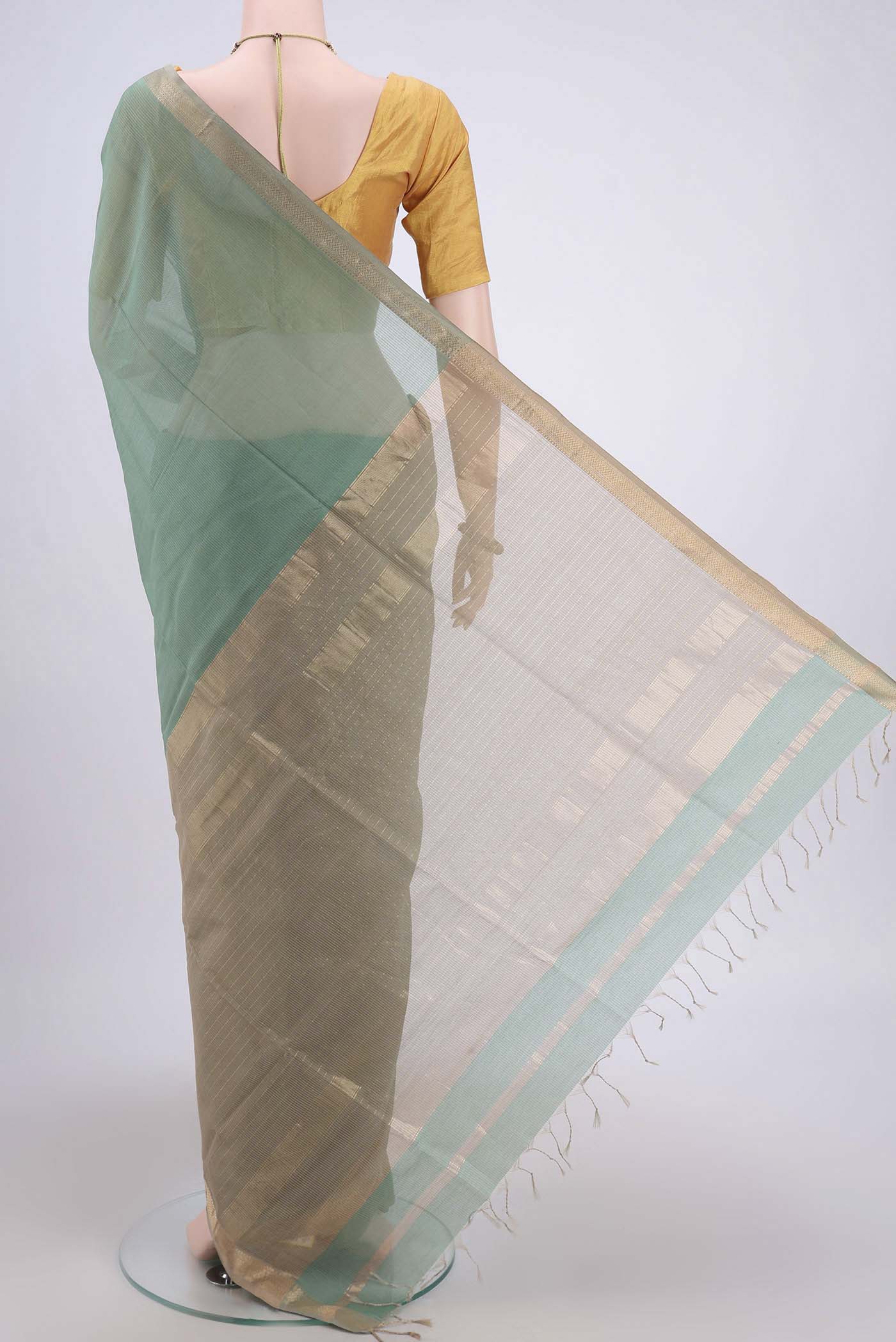 Flat view of Sage Green Maheshwari Silk Cotton Saree with Stripes on the body and Zari Border. 