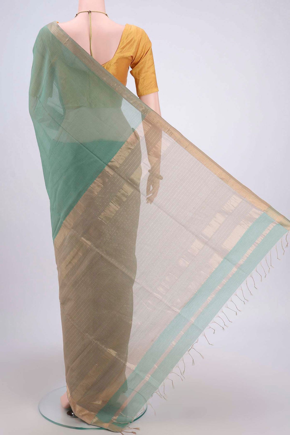 Flat view of Sage Green Maheshwari Silk Cotton Saree with Stripes on the body and Zari Border. 