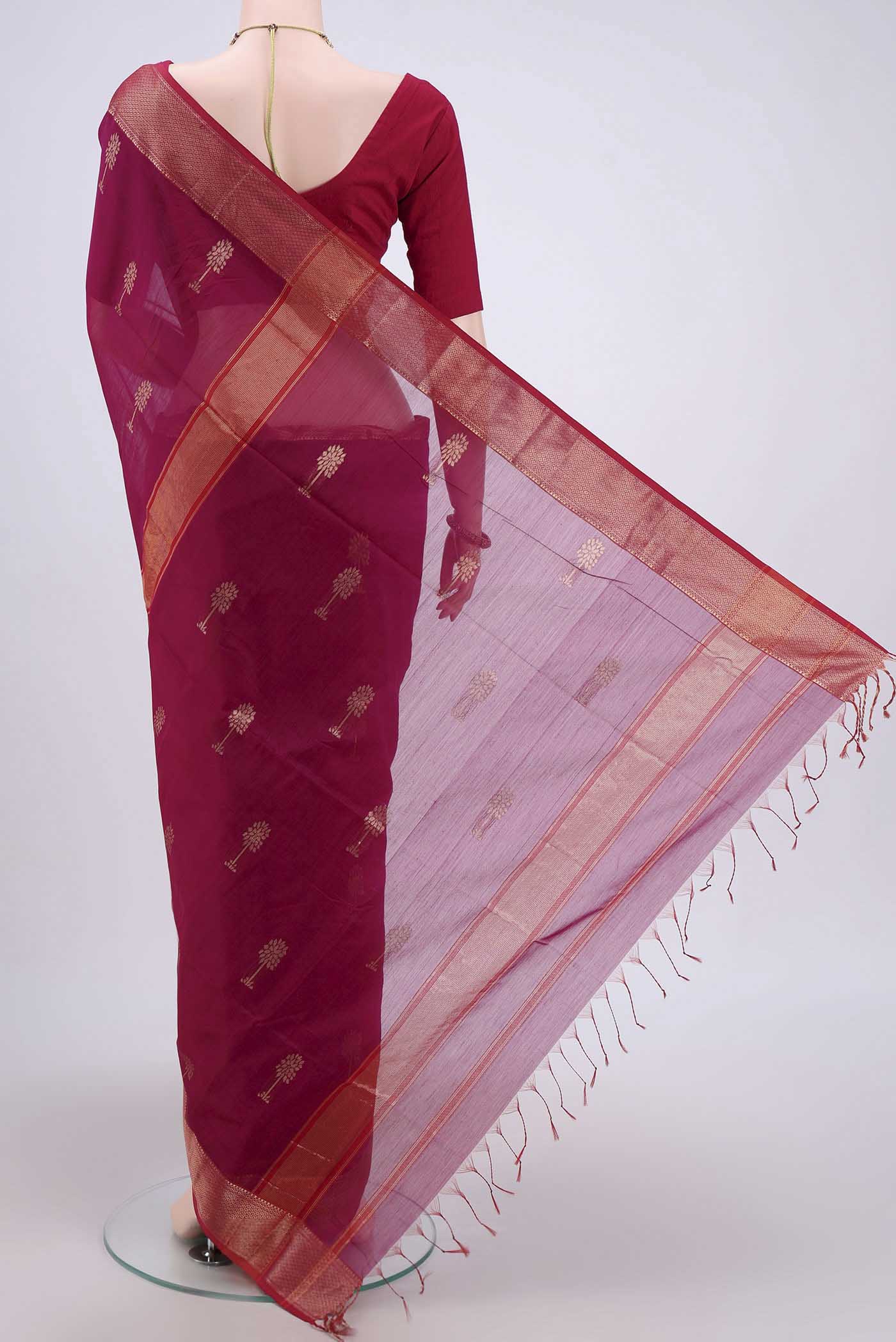 Flat view of Magenta Maheshwari Silk Cotton Saree with Stripes on the body and Zari Border. 