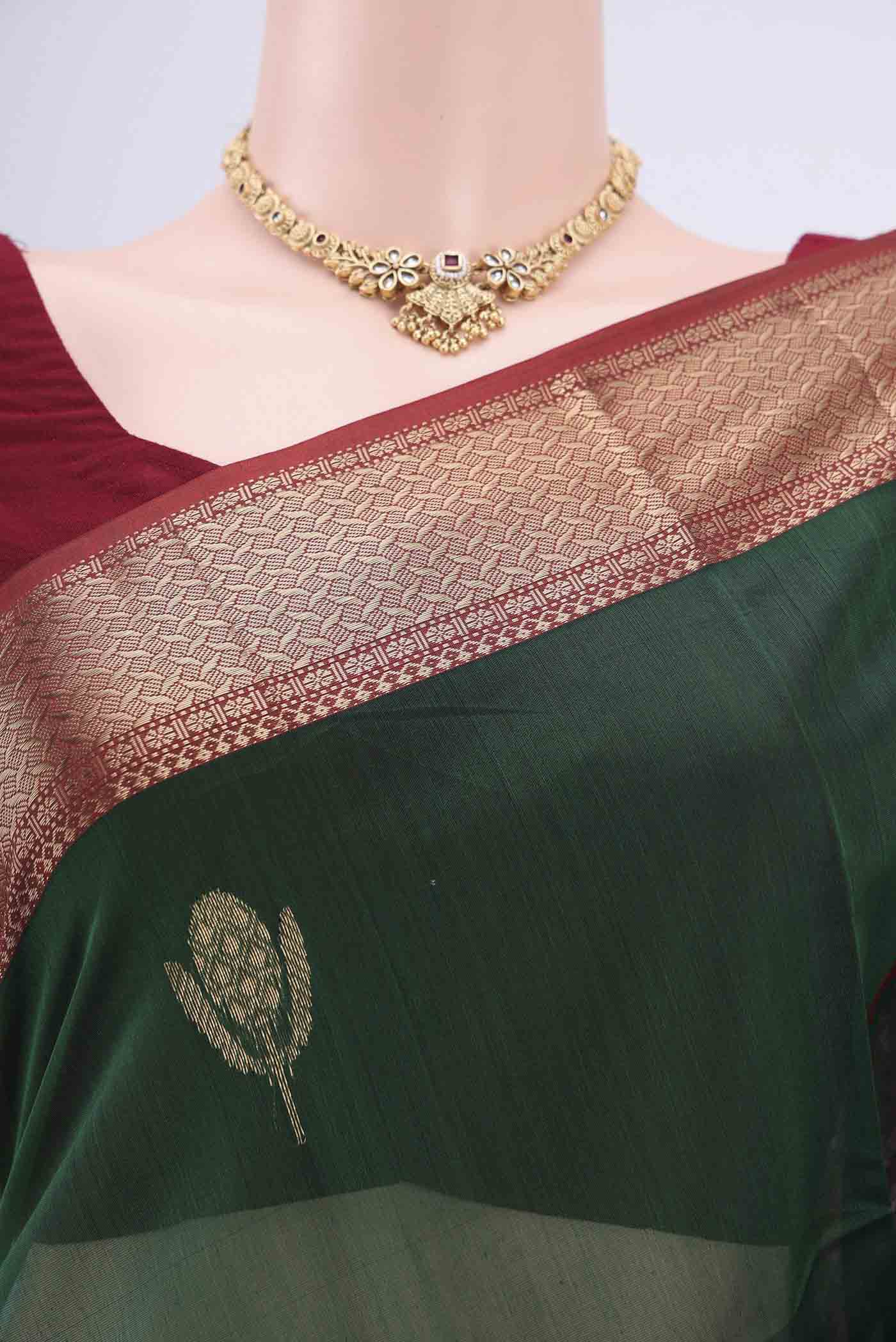 Border image of Bottle Green Maheshwari Silk Cotton Saree with Stripes on the body and Zari Border. 