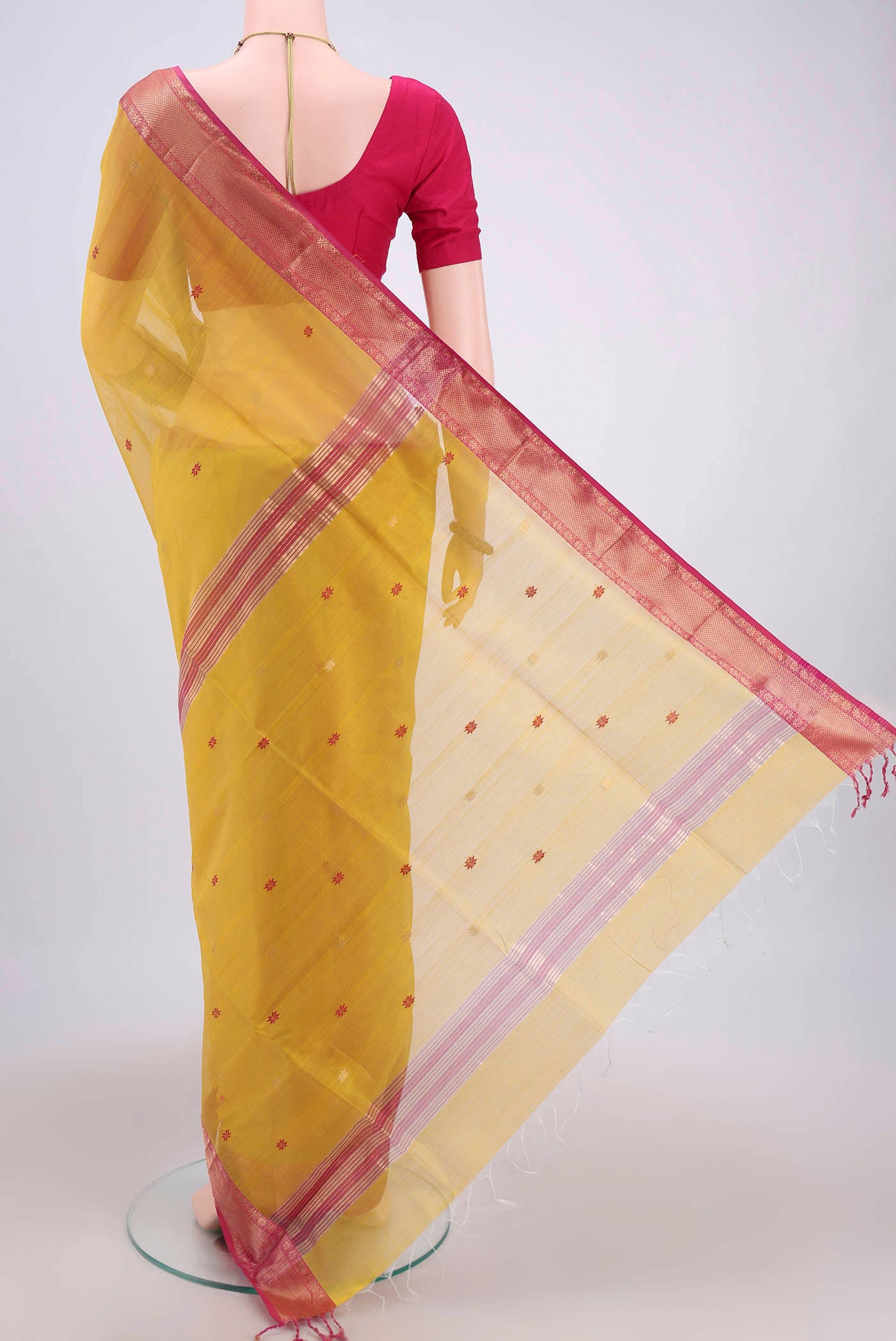 Flat view of Yellow Maheshwari Silk Cotton Saree with Plain Body and Zari Border. 