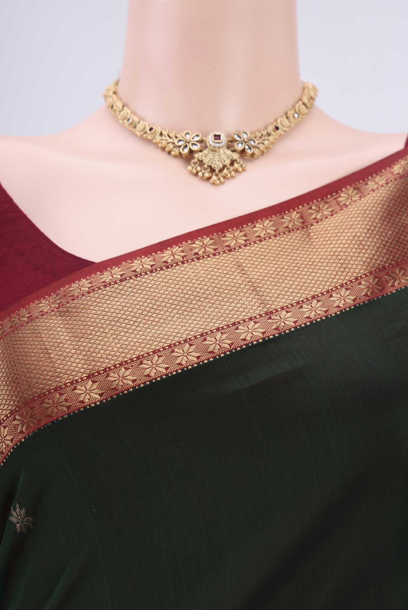 Border image of Bottle Green Maheshwari Silk Cotton Saree with Plain Body and Zari Border. 