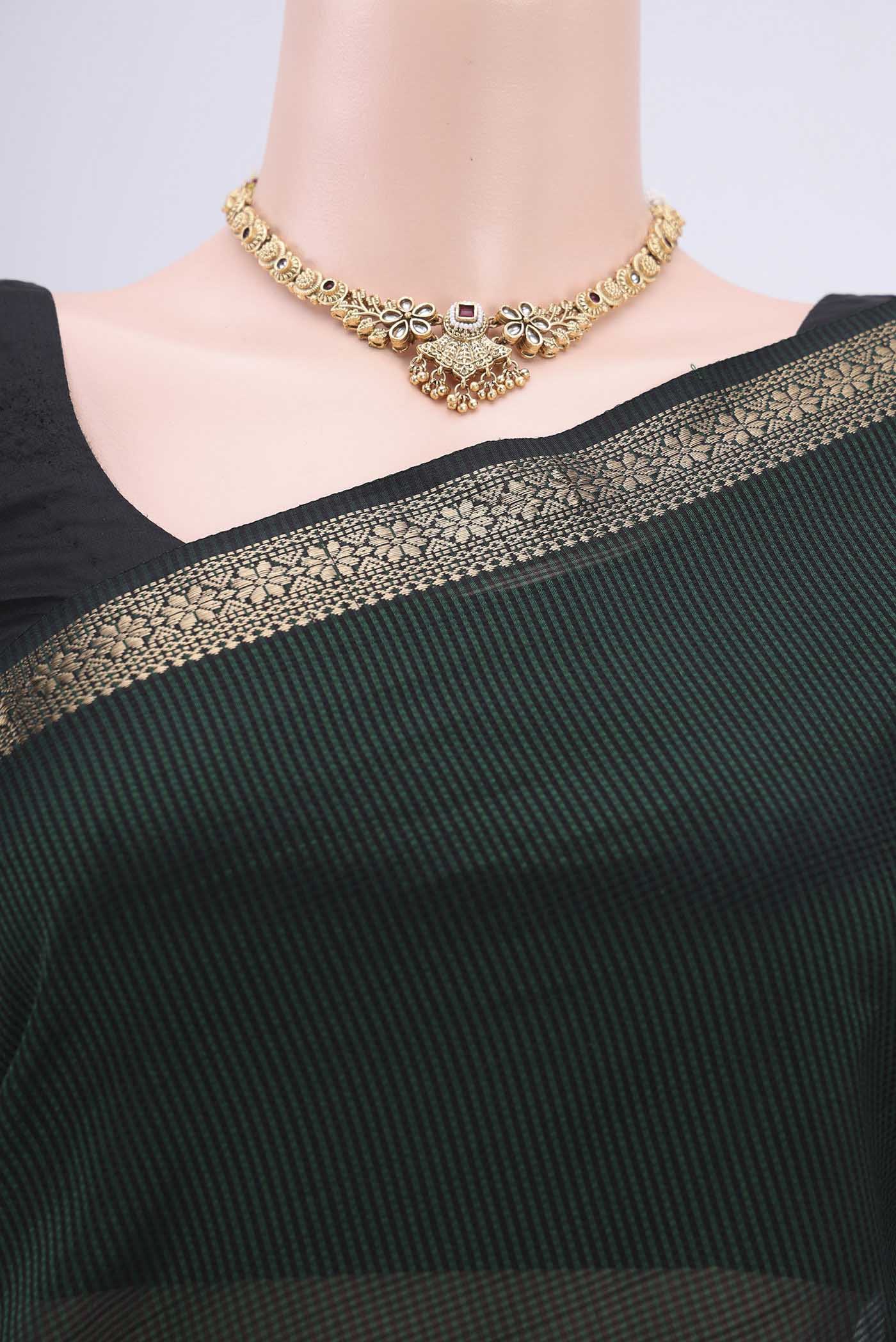 Border image of Bottle Green Maheshwari Silk Cotton Saree with Plain Body and Zari Border. 