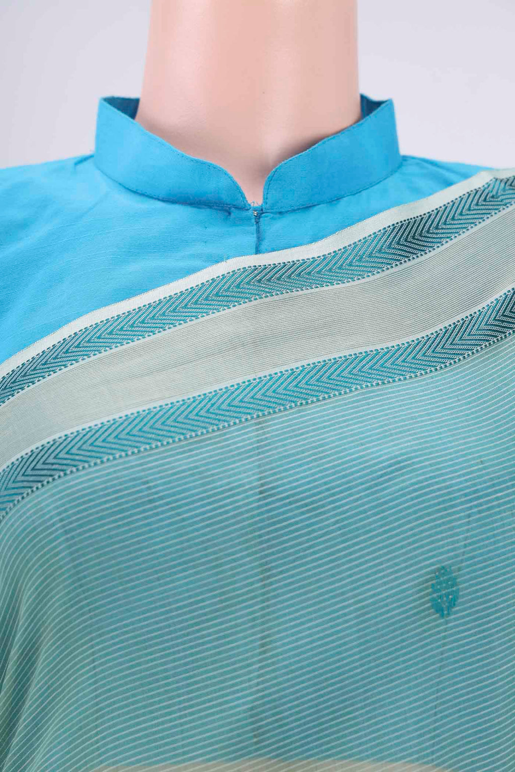 Border image of Sage Green Maheshwari Silk Cotton Saree with Thread Butta on the body and Zari And Thread Border. 
