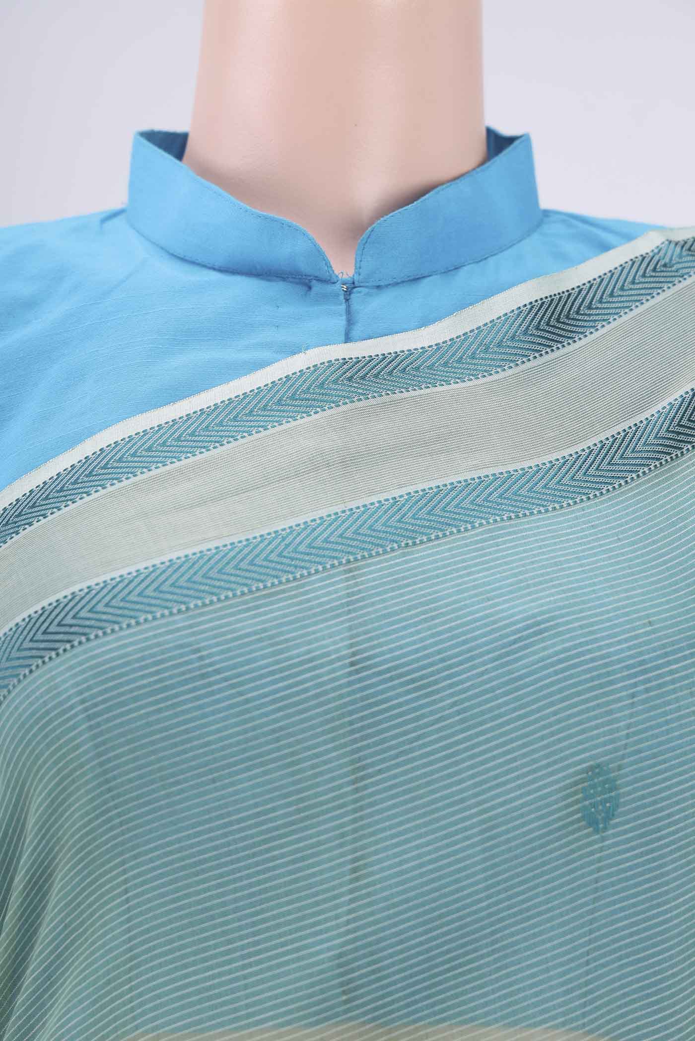 Border image of Sage Green Maheshwari Silk Cotton Saree with Thread Butta on the body and Zari And Thread Border. 