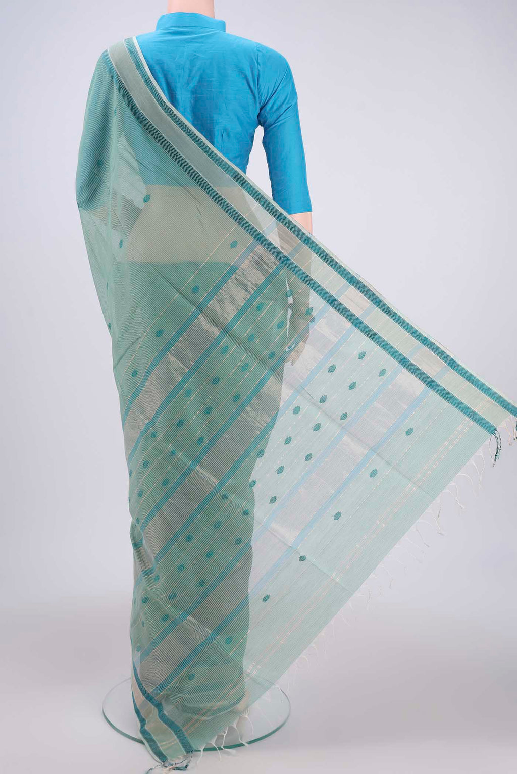 Flat view of Sage Green Maheshwari Silk Cotton Saree with Thread Butta on the body and Zari And Thread Border. 