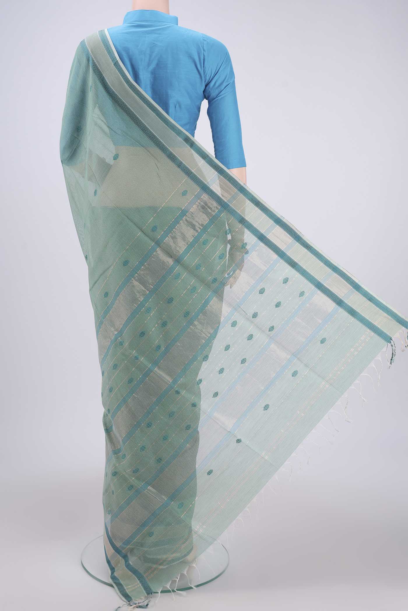 Flat view of Sage Green Maheshwari Silk Cotton Saree with Thread Butta on the body and Zari And Thread Border. 