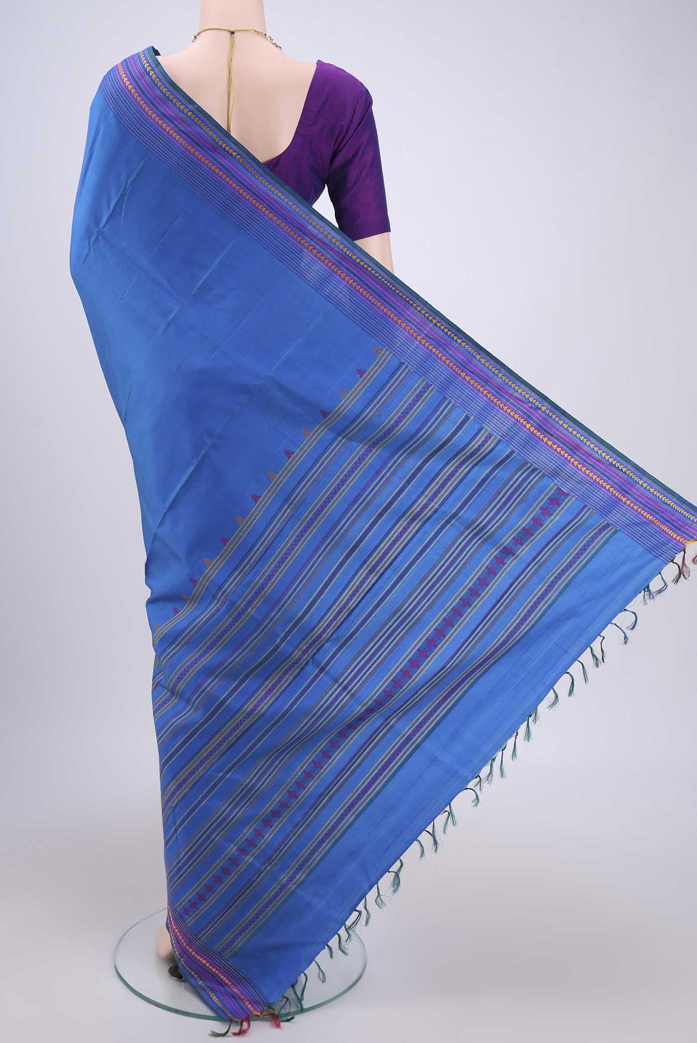 Flat view of Blue Kanchipuram Saree with Plain Body and Thread Border. 
