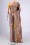Brown Kanchipuram Silk Saree with Plain Body and Zari Border.  displayed on a mannequin