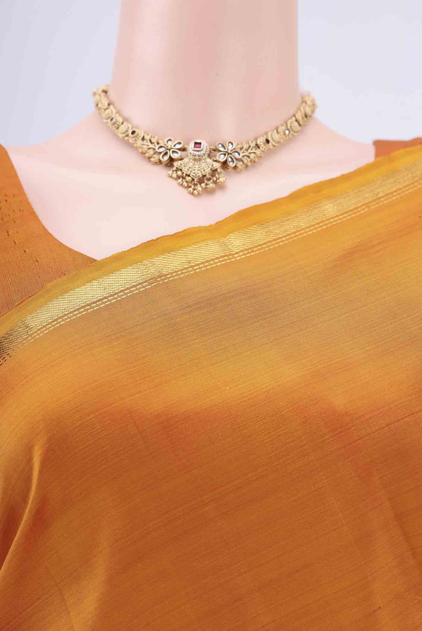 Border image of Mustard Dual Tone Kanjivaram Silk Saree with Plain Body and Zari Border. 