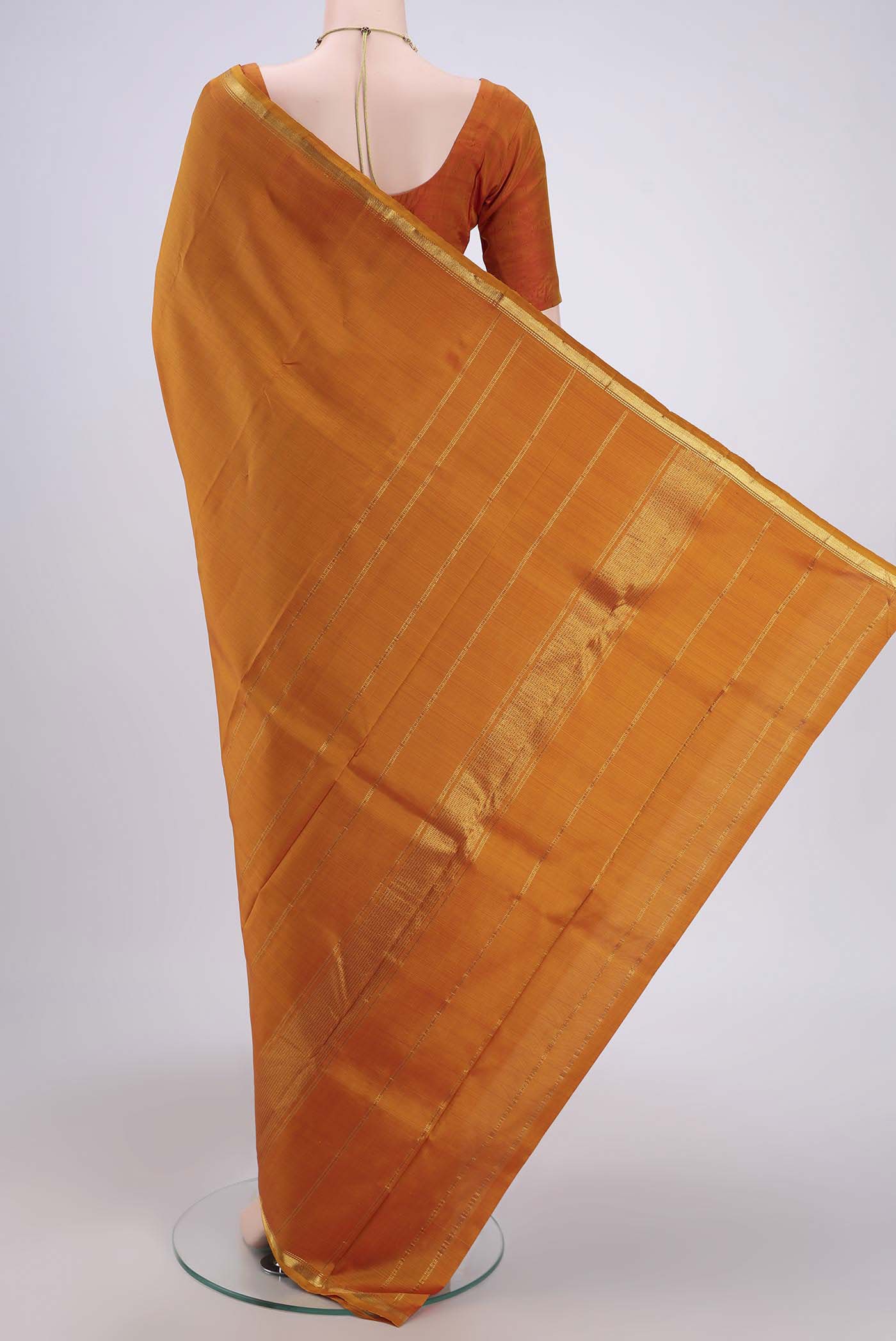 Flat view of Mustard Dual Tone Kanjivaram Silk Saree with Plain Body and Zari Border. 