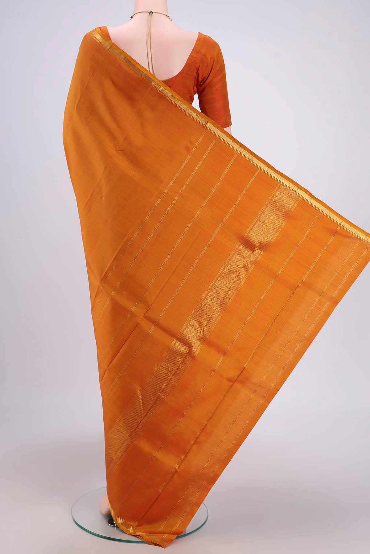 Flat view of Mustard Dual Tone Kanjivaram Silk Saree with Plain Body and Zari Border. 