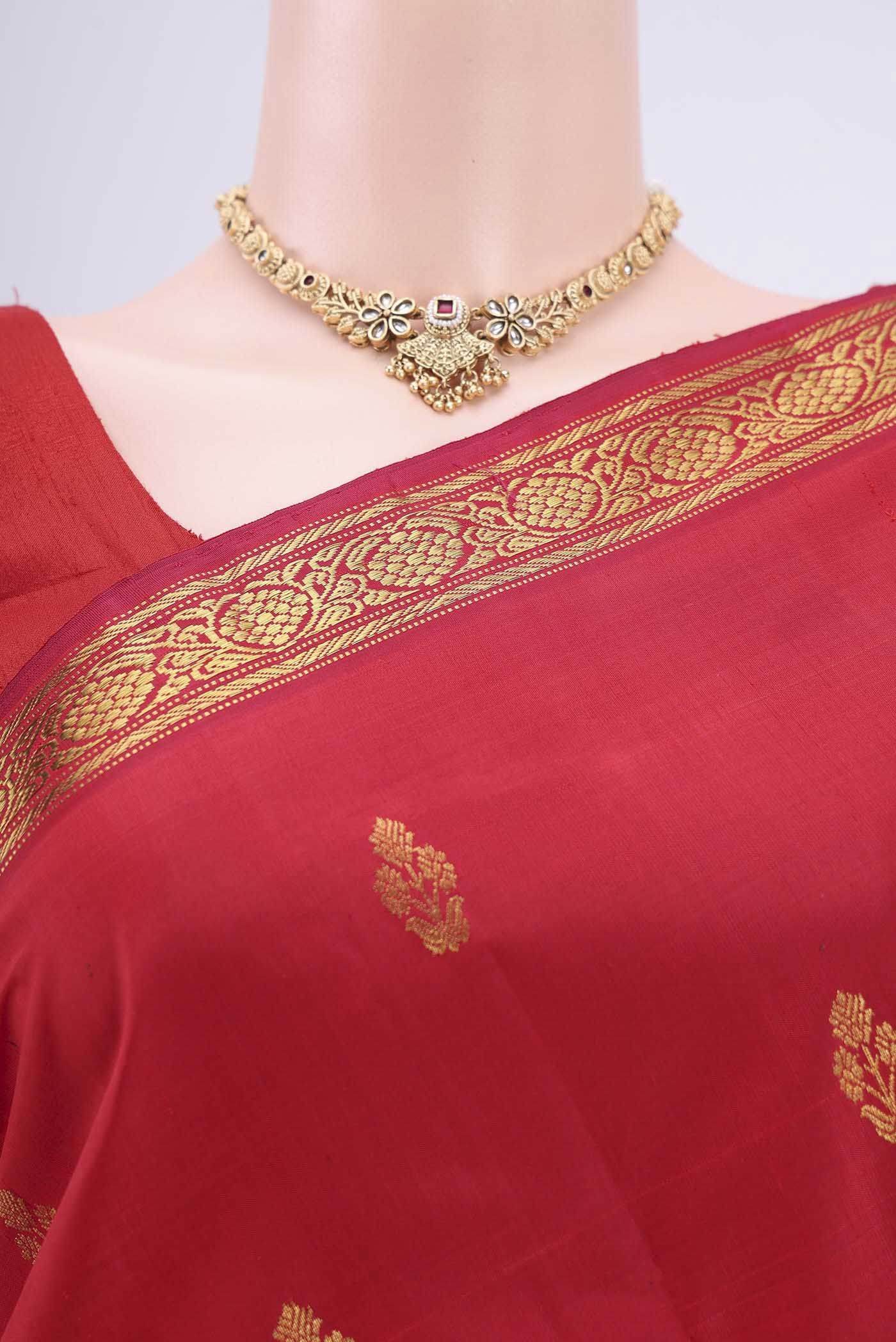 Border image of Maroon Dual Tone Kanjivaram Silk Saree with Zari Butta on the body and Zari Border. 