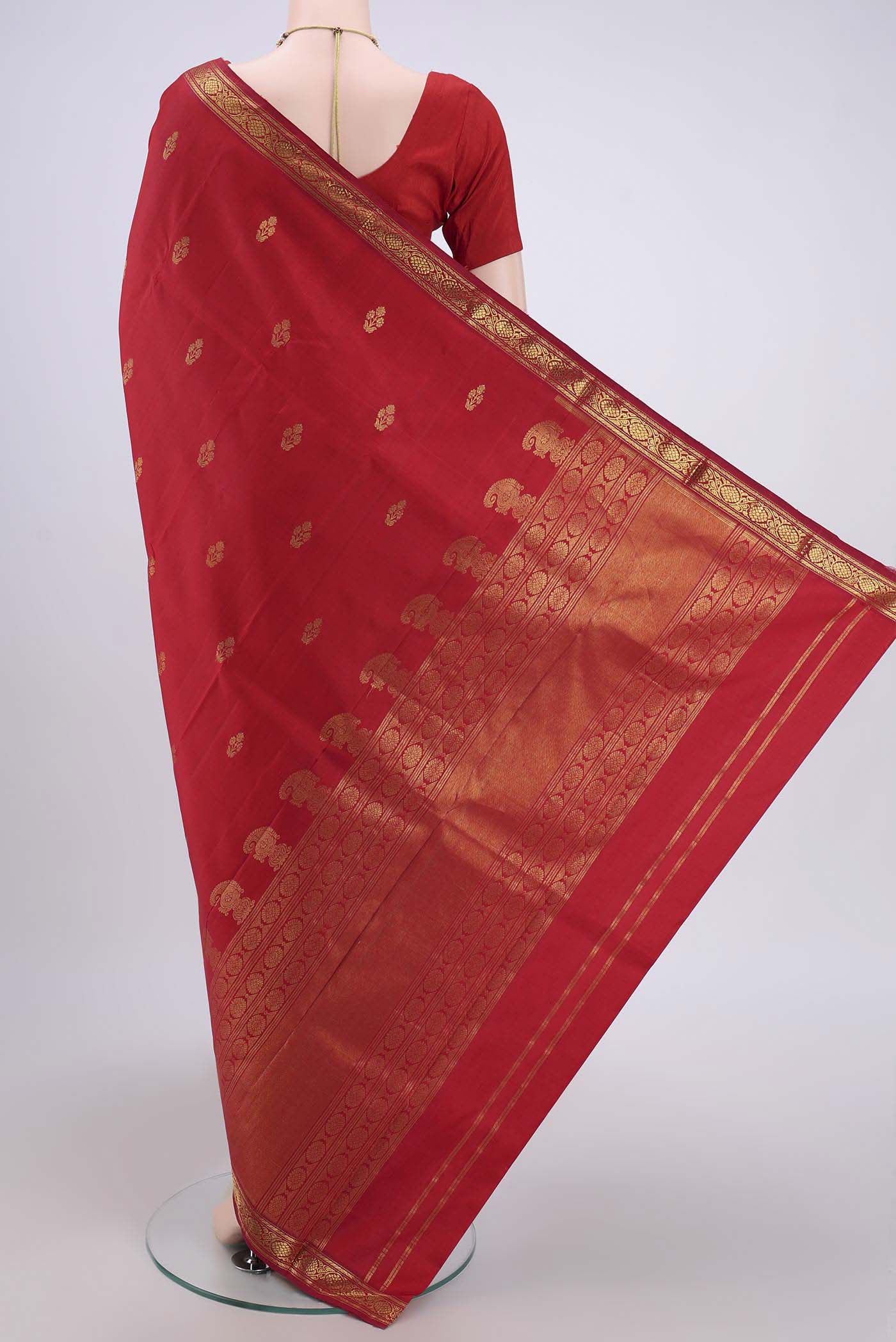 Flat view of Maroon Dual Tone Kanjivaram Silk Saree with Zari Butta on the body and Zari Border. 