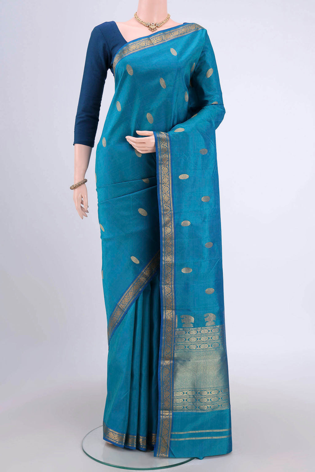 Blue Dual Tone Kanjivaram Silk Saree with Zari Butta on the body and Zari Border.  displayed on a mannequin