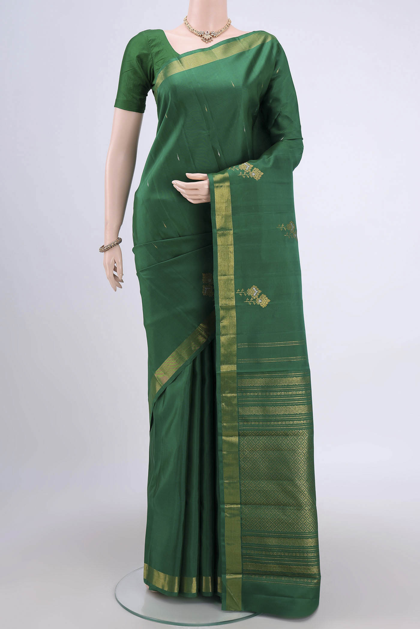 Green Dual Tone Kanjivaram Silk Saree with Plain Body and Zari Border.  displayed on a mannequin