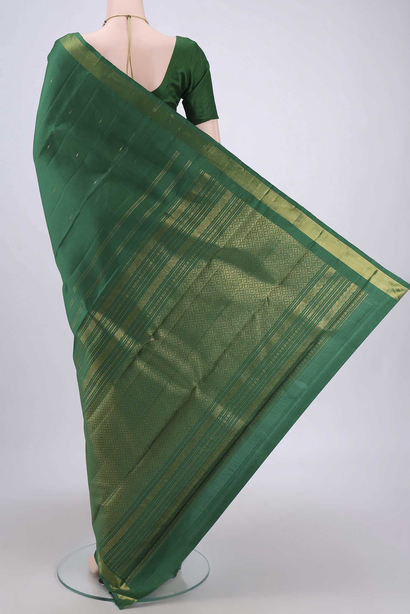 Flat view of Green Dual Tone Kanjivaram Silk Saree with Plain Body and Zari Border. 