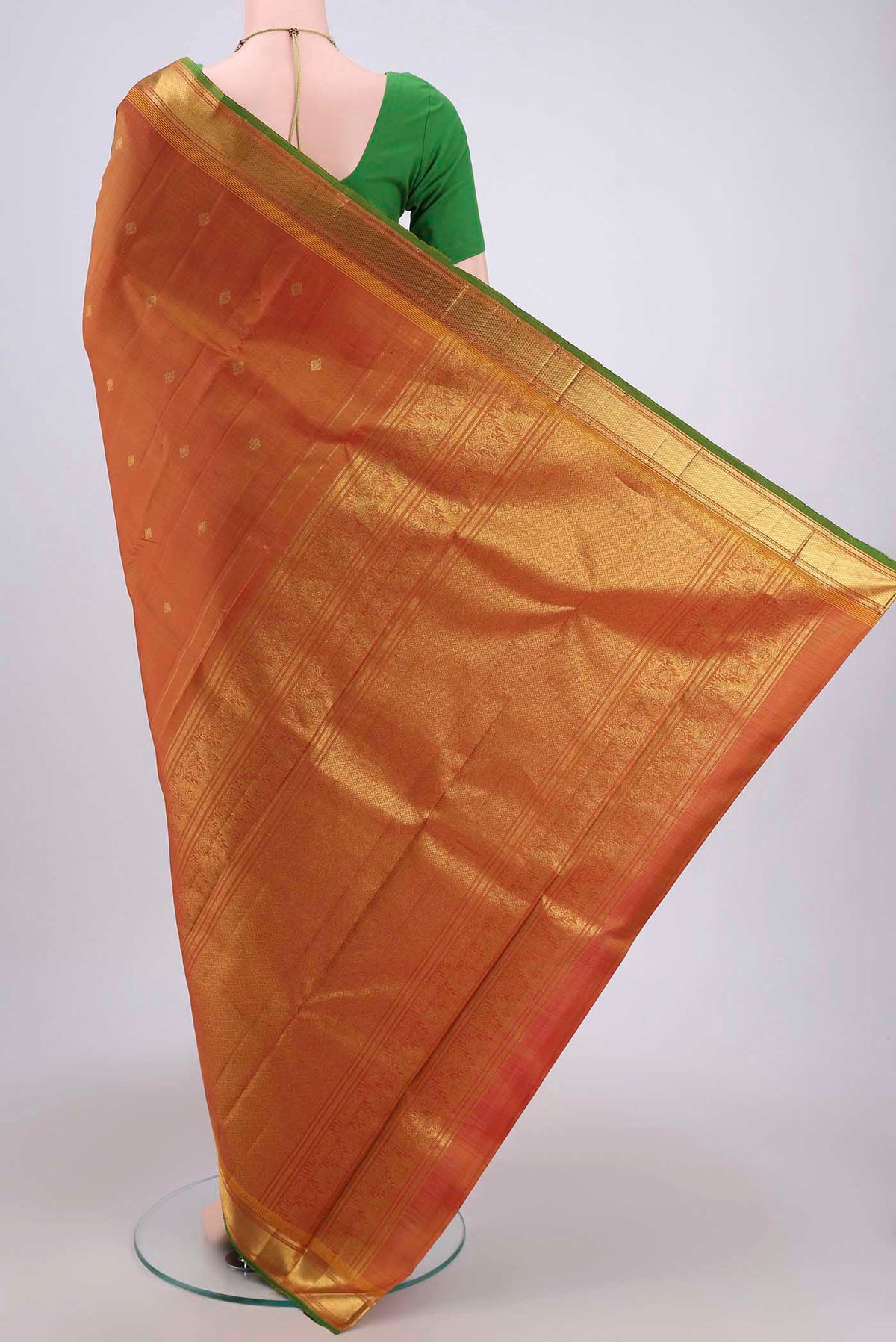 Flat view of Blue with Green Dual Tone Kanjivaram Silk Saree with Zari Butta on the body and Zari Border. 