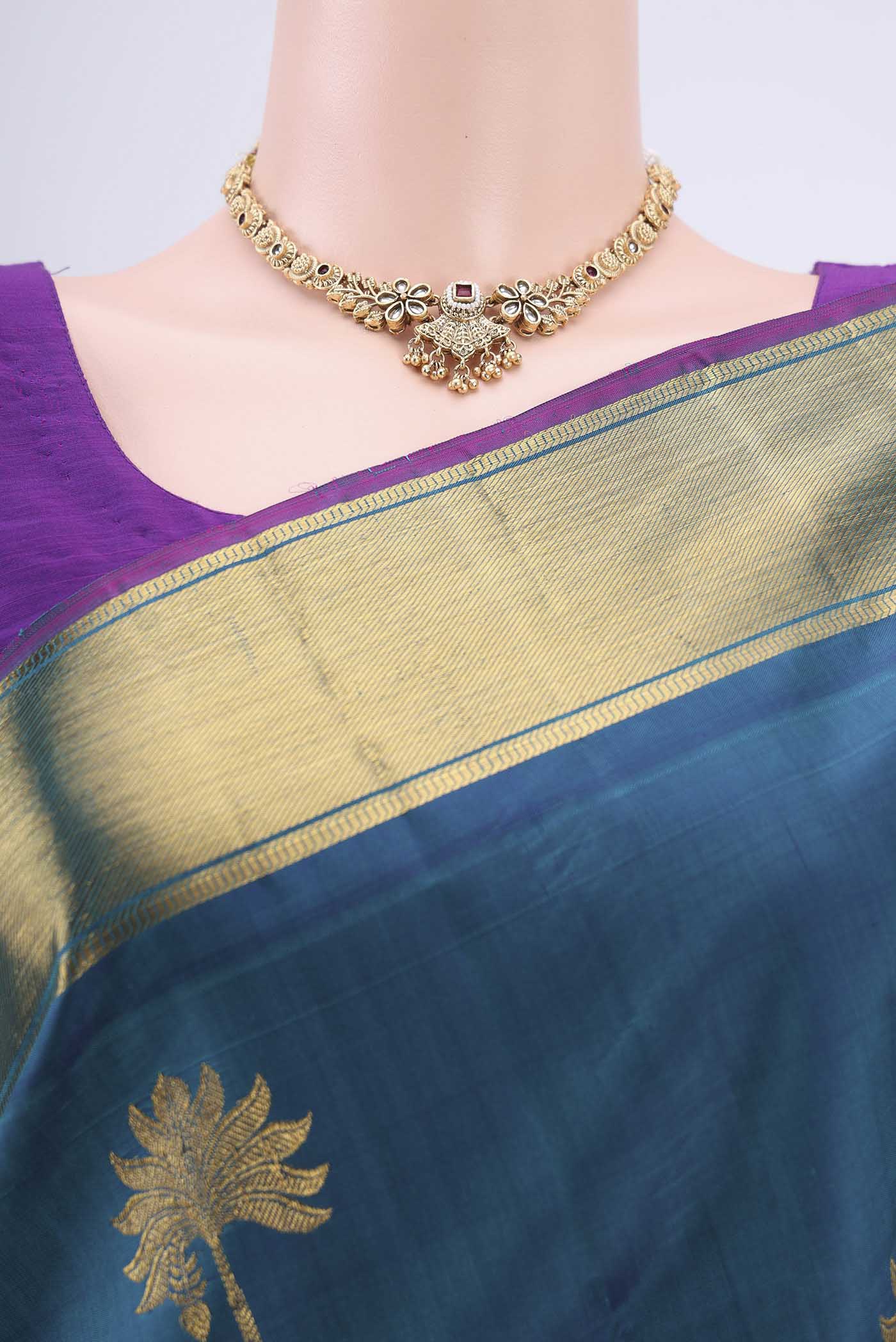 Border image of Peacock Blue Dual Tone Kanjivaram Silk Saree with Zari Butta on the body and Zari Border. 