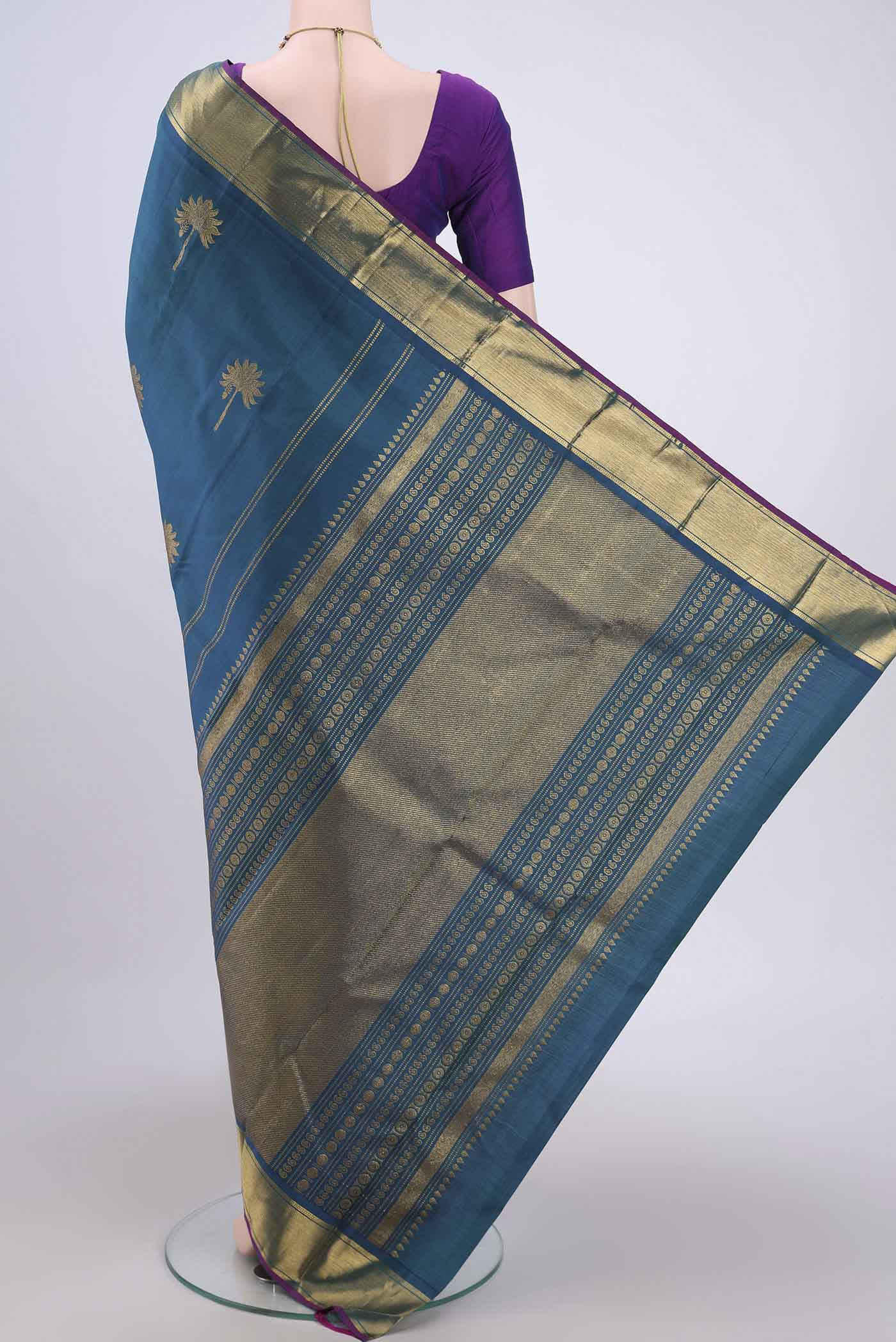 Flat view of Peacock Blue Dual Tone Kanjivaram Silk Saree with Zari Butta on the body and Zari Border. 