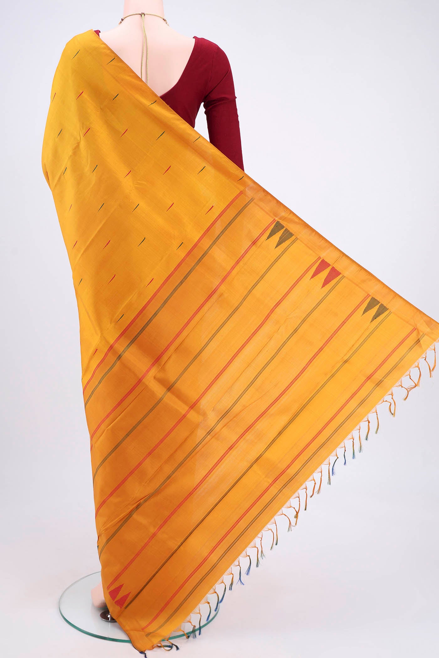 Flat view of Mustard Kanchipuram Silk Saree with Thread Butta on the body and Plain Border. 