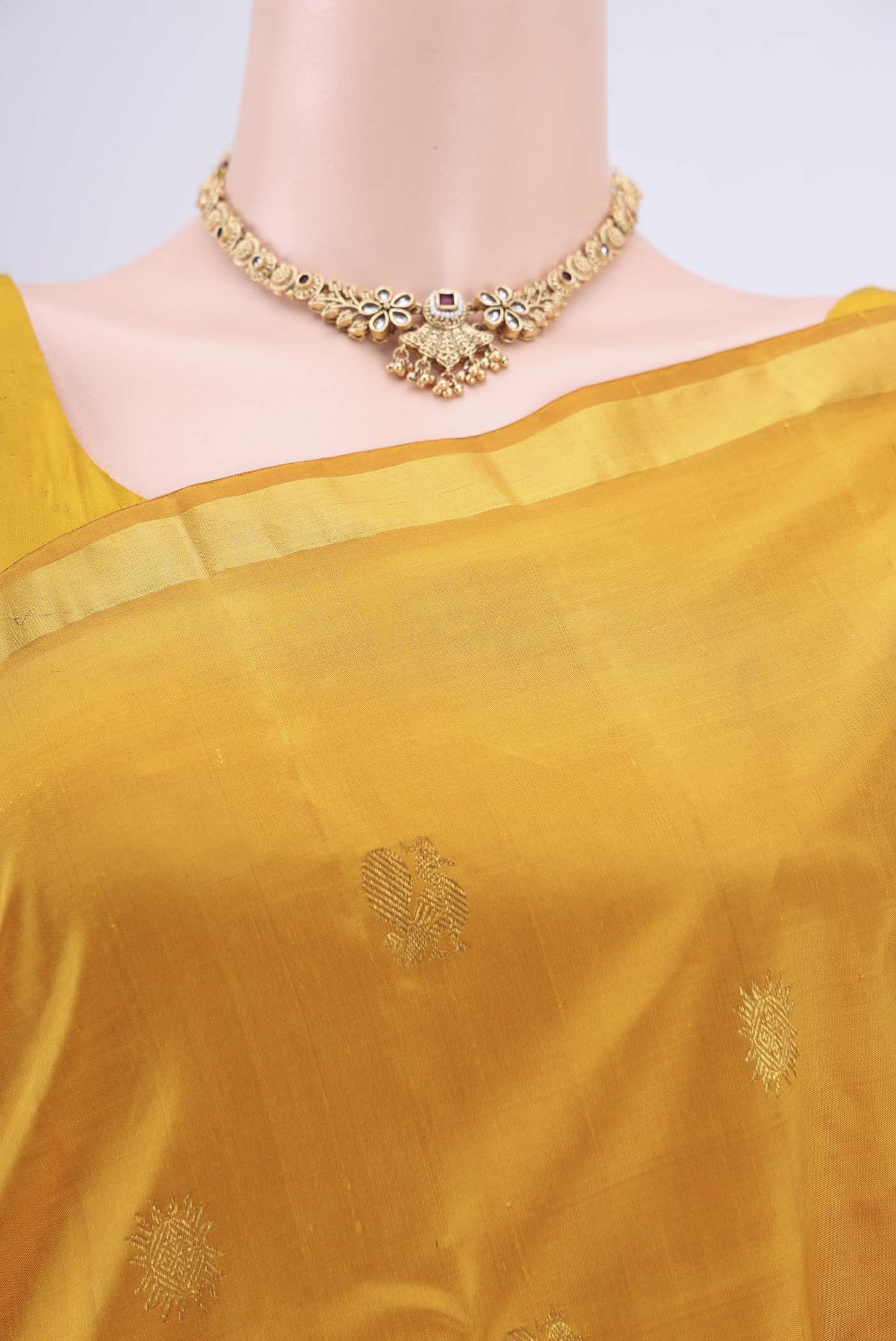 Border image of Mustard Dual Tone Kanchipuram Silk Saree with Zari Butta on the body and Zari Border. 