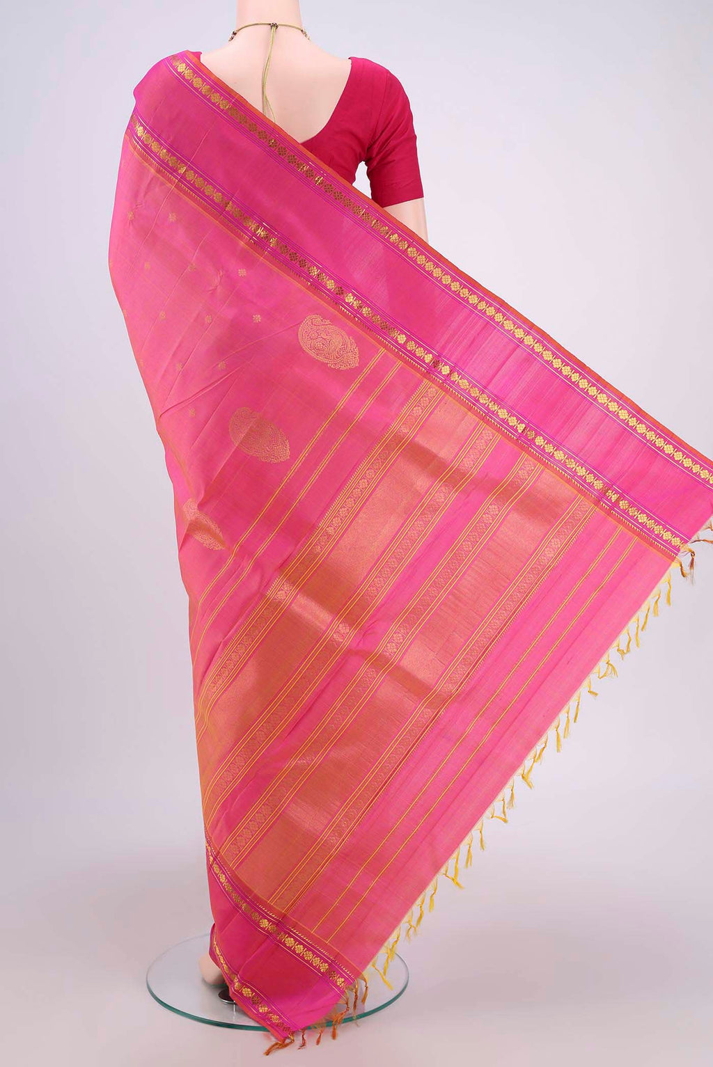 Flat view of Pink Dual Tone Kanchipuram Silk Saree with Zari Butta on the body and Zari Border. 
