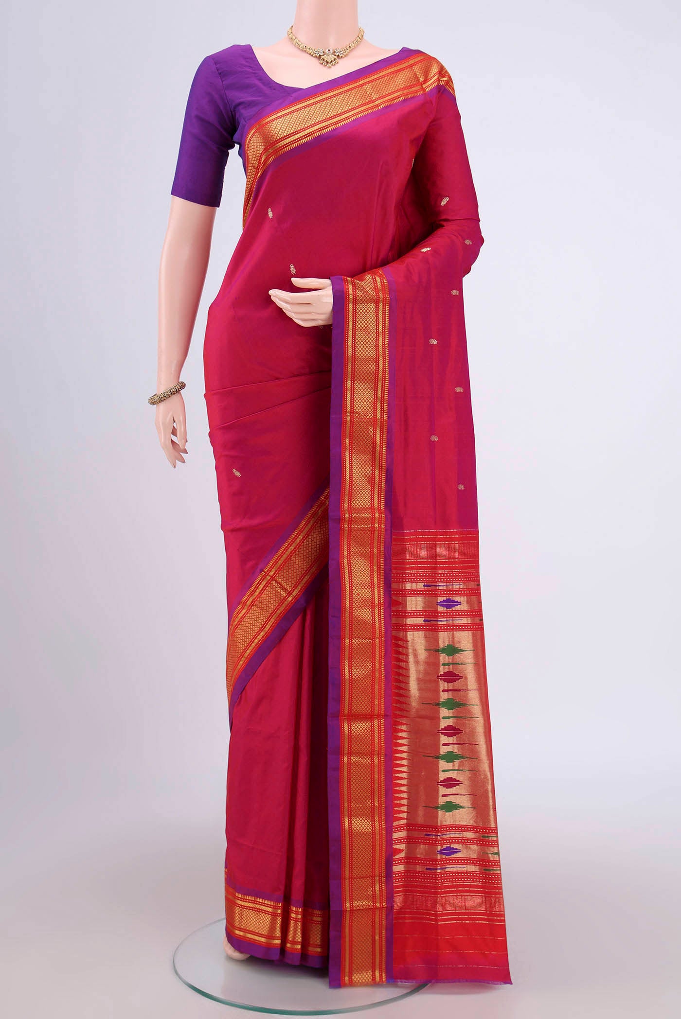 Pink Soft Silk Saree with Zari Butta on the body and Zari Border.  displayed on a mannequin