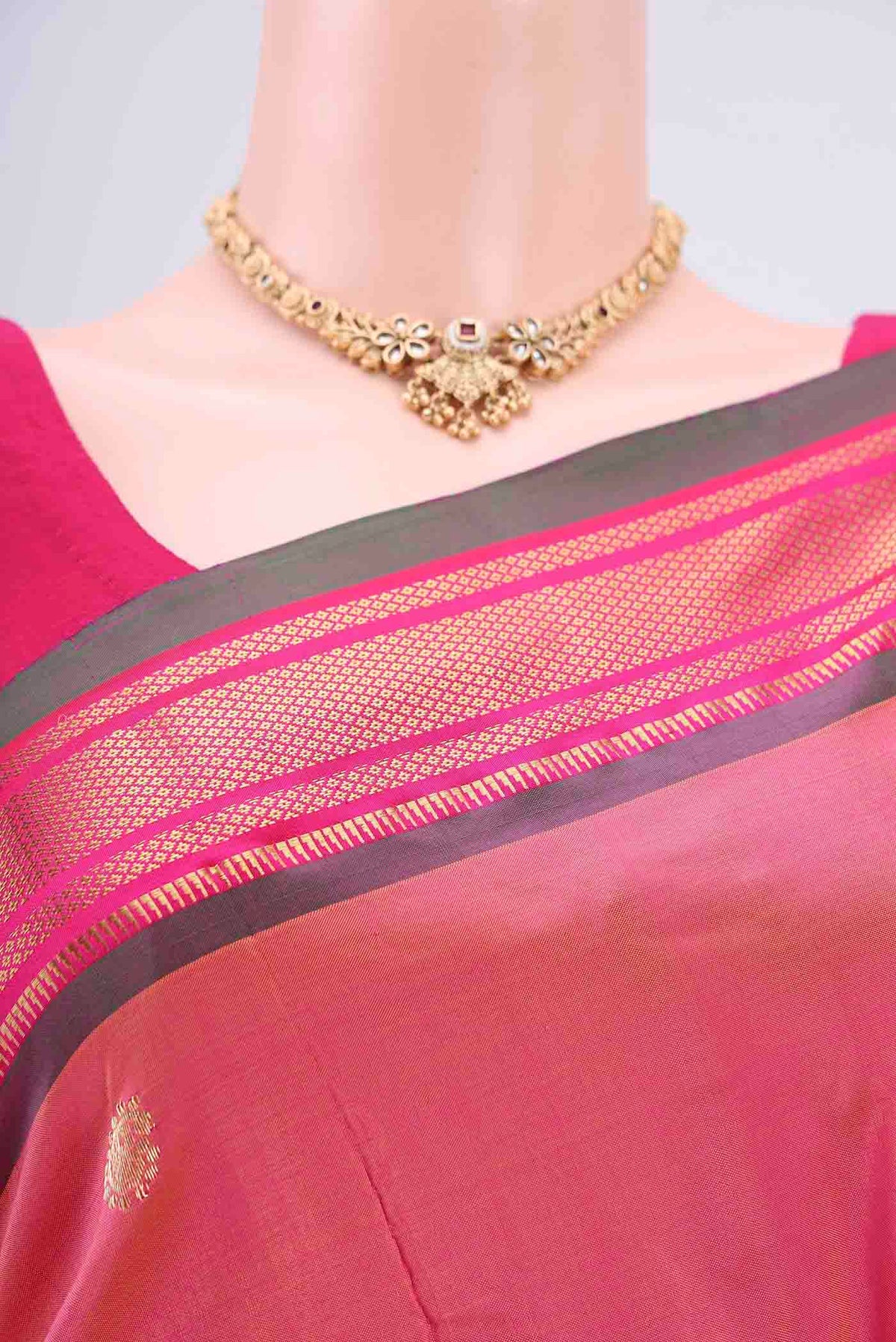 Border image of Pinkish Yellow Soft Silk Saree with Zari Butta on the body and Zari Border. 