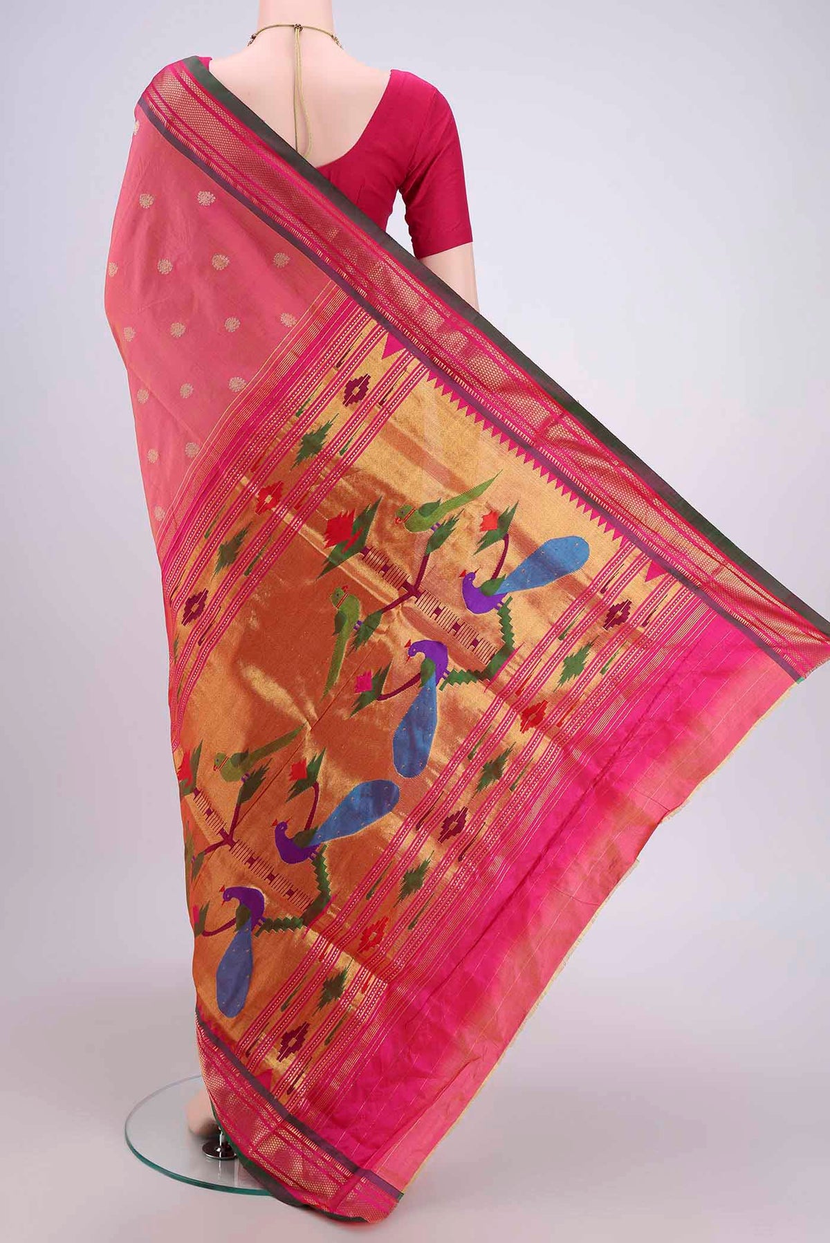 Flat view of Pinkish Yellow Soft Silk Saree with Zari Butta on the body and Zari Border. 