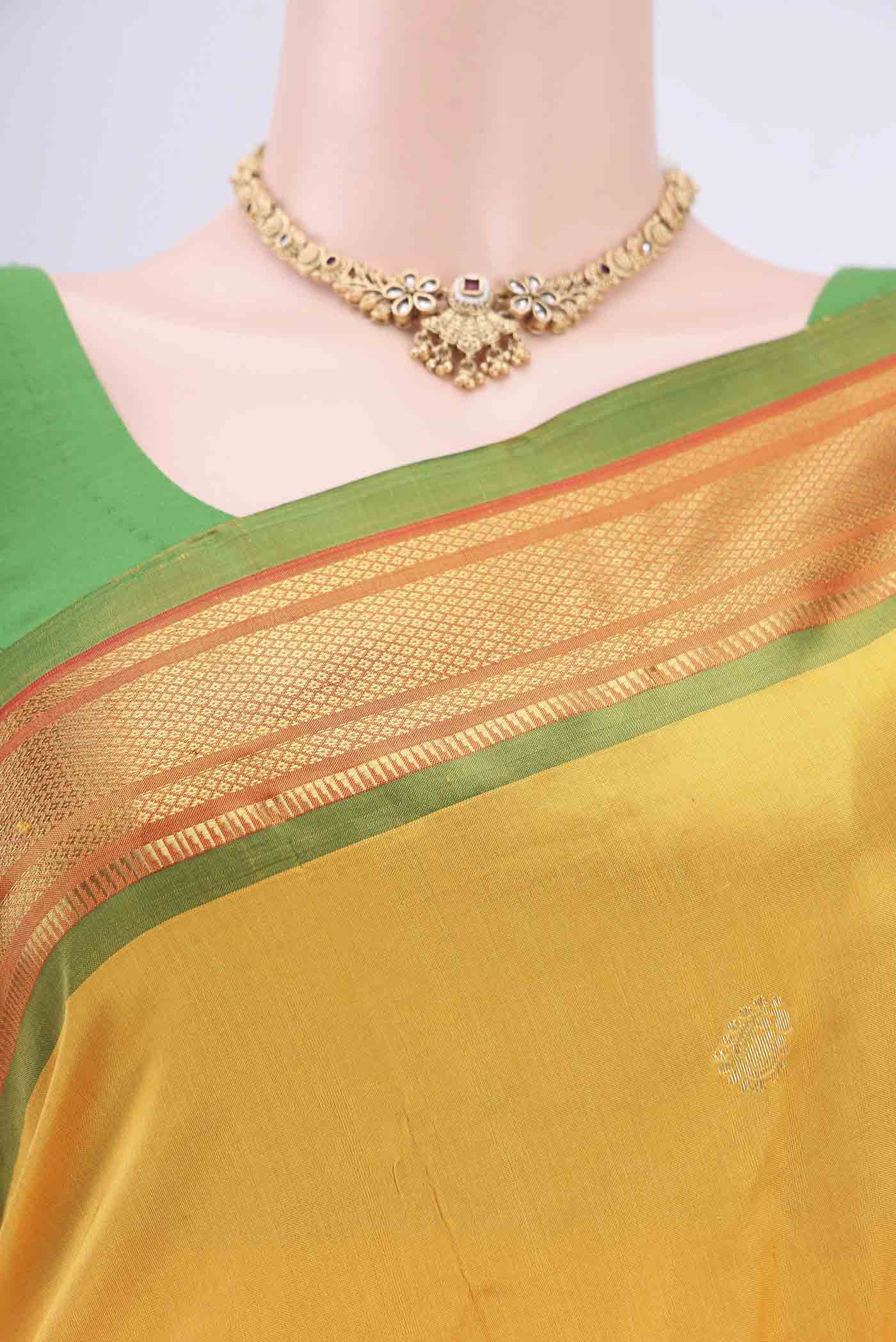 Border image of Yellow Soft Silk Saree with Zari Butta on the body and Zari Border. 