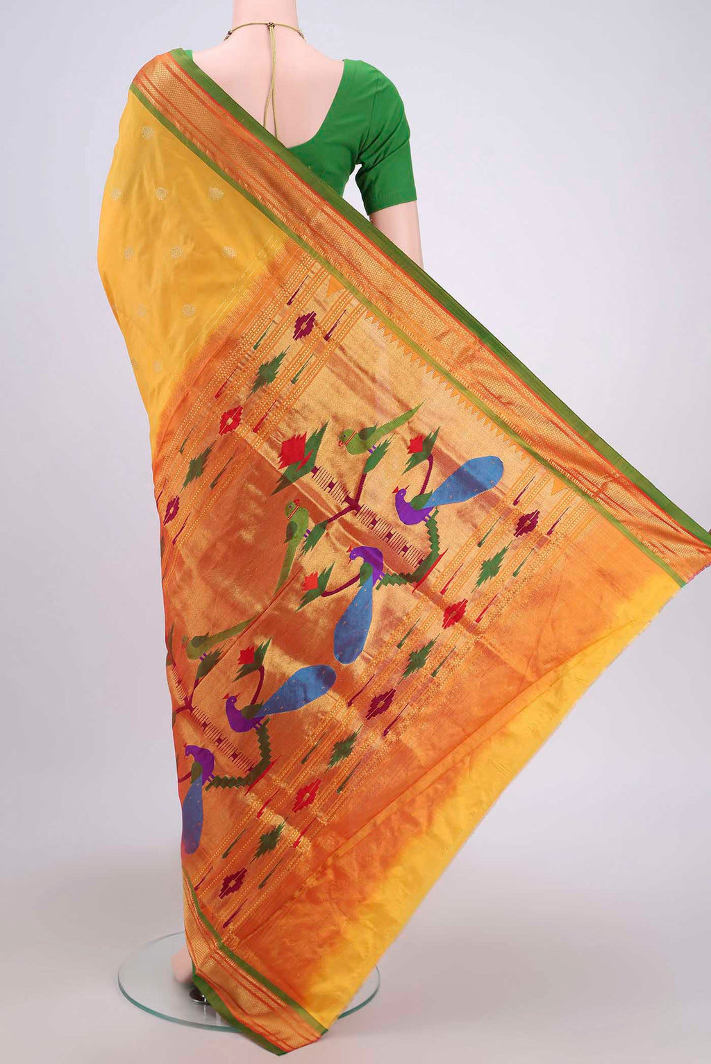 Flat view of Yellow Soft Silk Saree with Zari Butta on the body and Zari Border. 