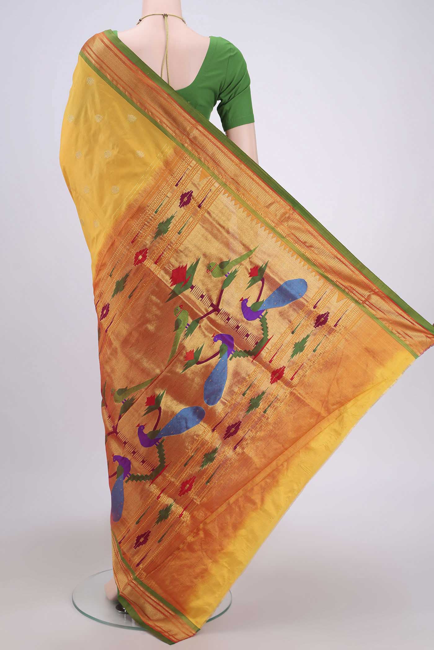 Flat view of Yellow Soft Silk Saree with Zari Butta on the body and Zari Border. 