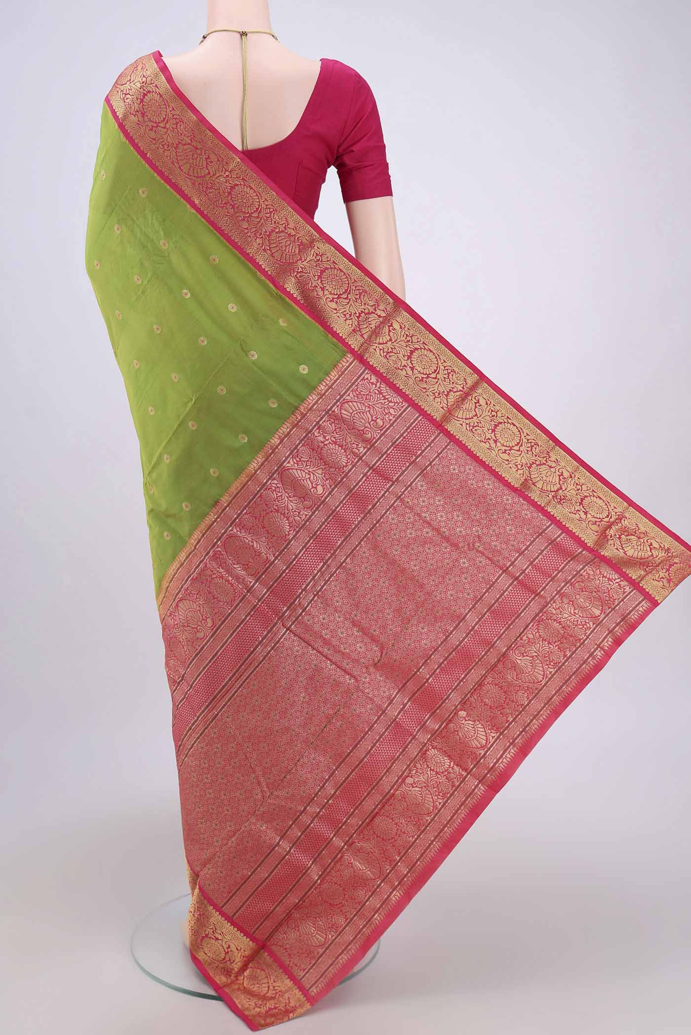Flat view of Parrot Green Blended Bangalore Silk Saree with Zari And Thread Butta on the body and Zari Border. 