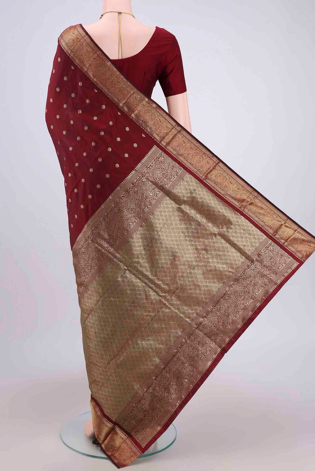 Flat view of Maroon Blended Bangalore Silk Saree with Zari Butta on the body and Zari Border. 