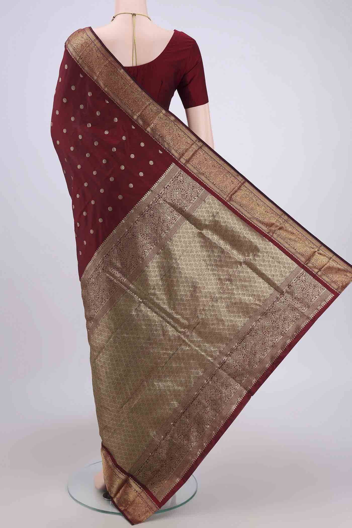 Flat view of Maroon Blended Bangalore Silk Saree with Zari Butta on the body and Zari Border. 