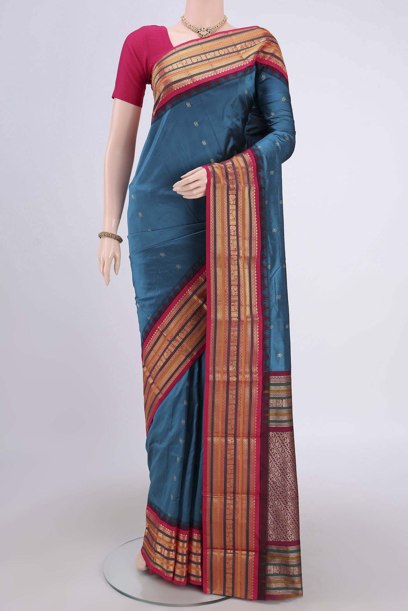 Blue Blended Bangalore Silk Saree with Zari Butta on the body and Zari Border.  displayed on a mannequin