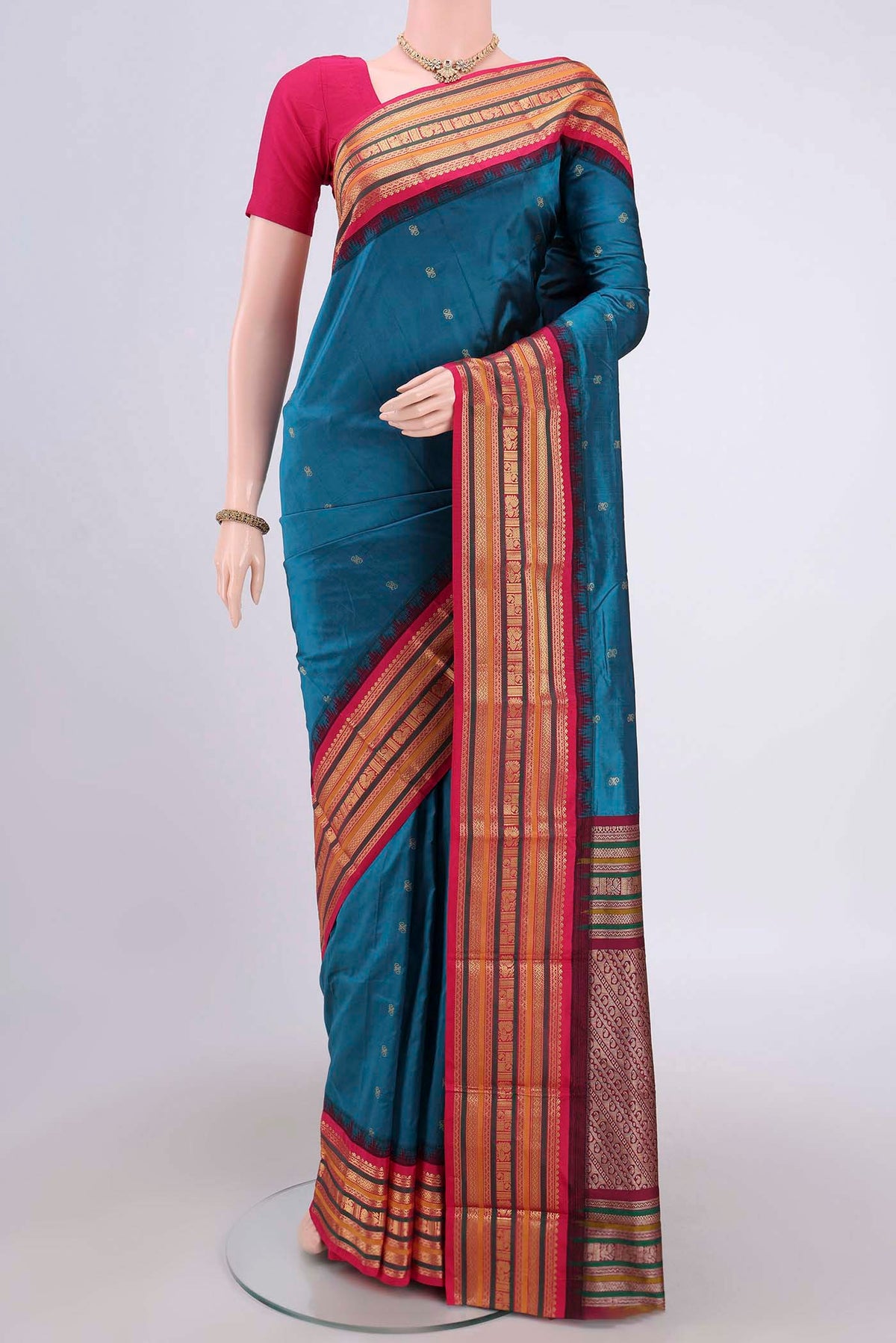 Blue Blended Bangalore Silk Saree with Zari Butta on the body and Zari Border.  displayed on a mannequin