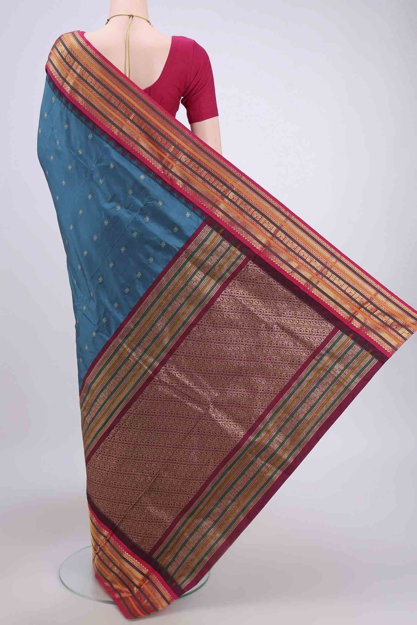 Flat view of Blue Blended Bangalore Silk Saree with Zari Butta on the body and Zari Border. 
