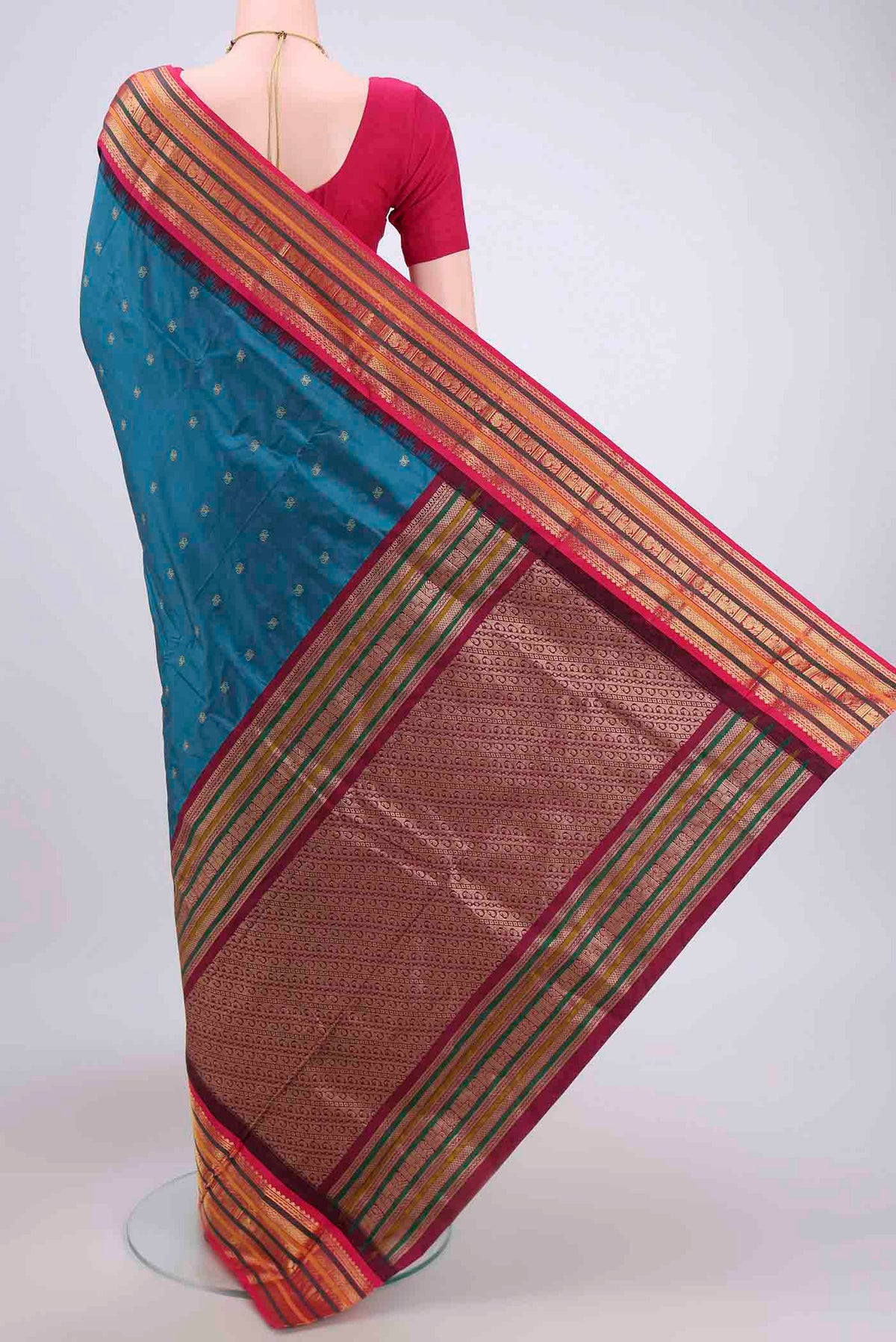 Flat view of Blue Blended Bangalore Silk Saree with Zari Butta on the body and Zari Border. 