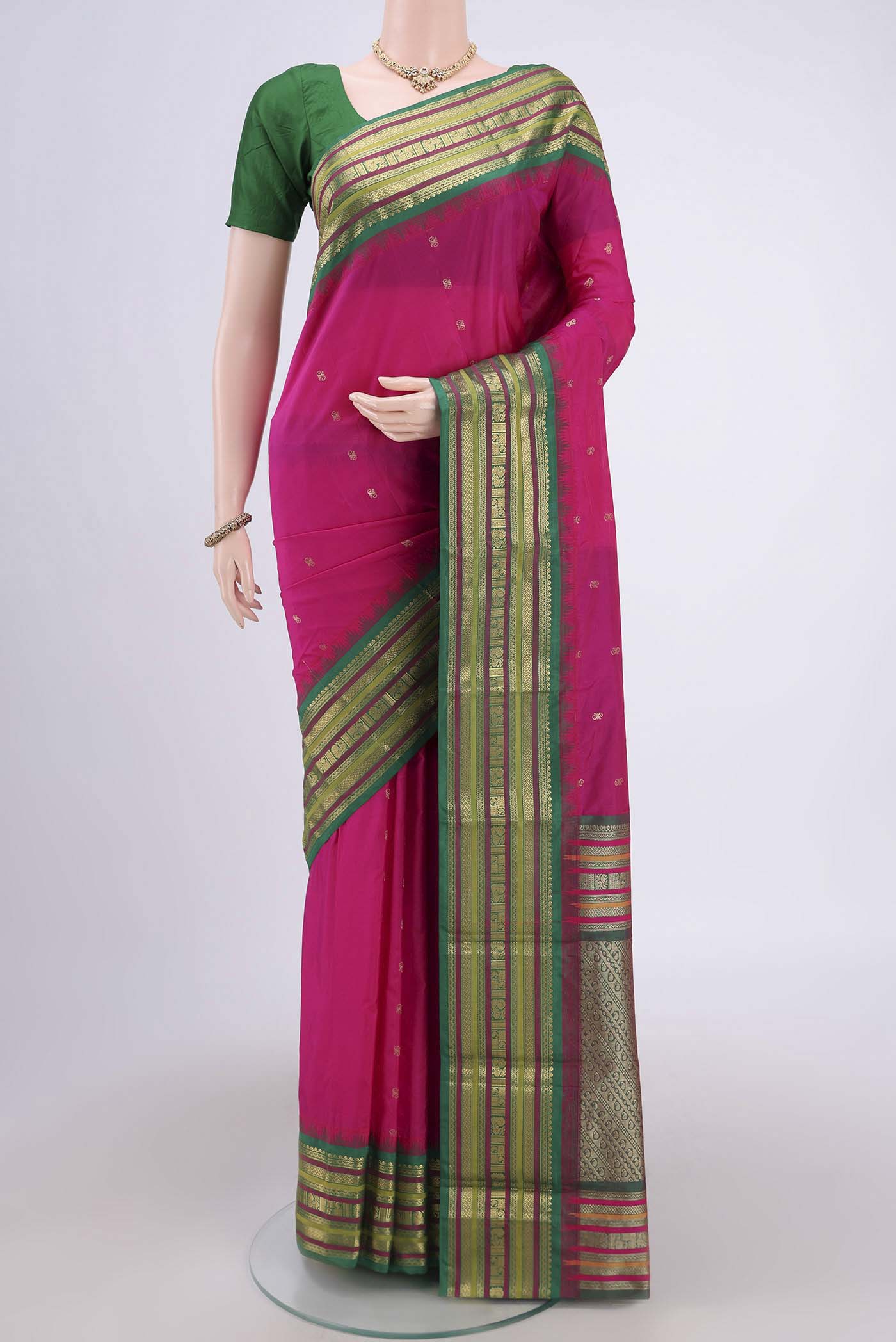 Rani Pink Blended Bangalore Silk Saree with Zari Butta on the body and Zari Border.  displayed on a mannequin