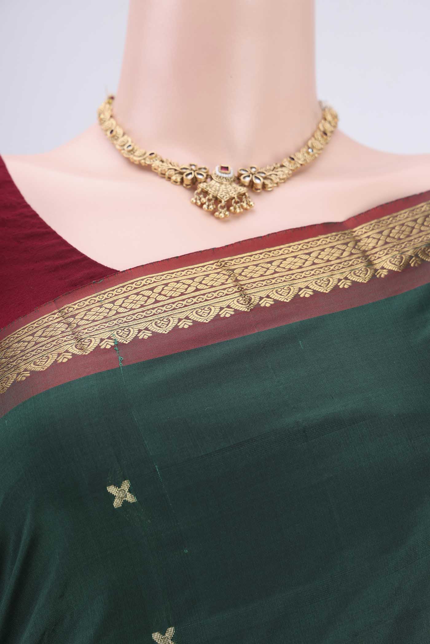 Border image of Bottle Green Blended Bangalore Silk Saree with Zari Butta on the body and Zari Border. 