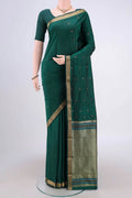 Bottle Green Blended Bangalore Silk Saree with Zari And Thread Butta on the body and Zari Border.  displayed on a mannequin