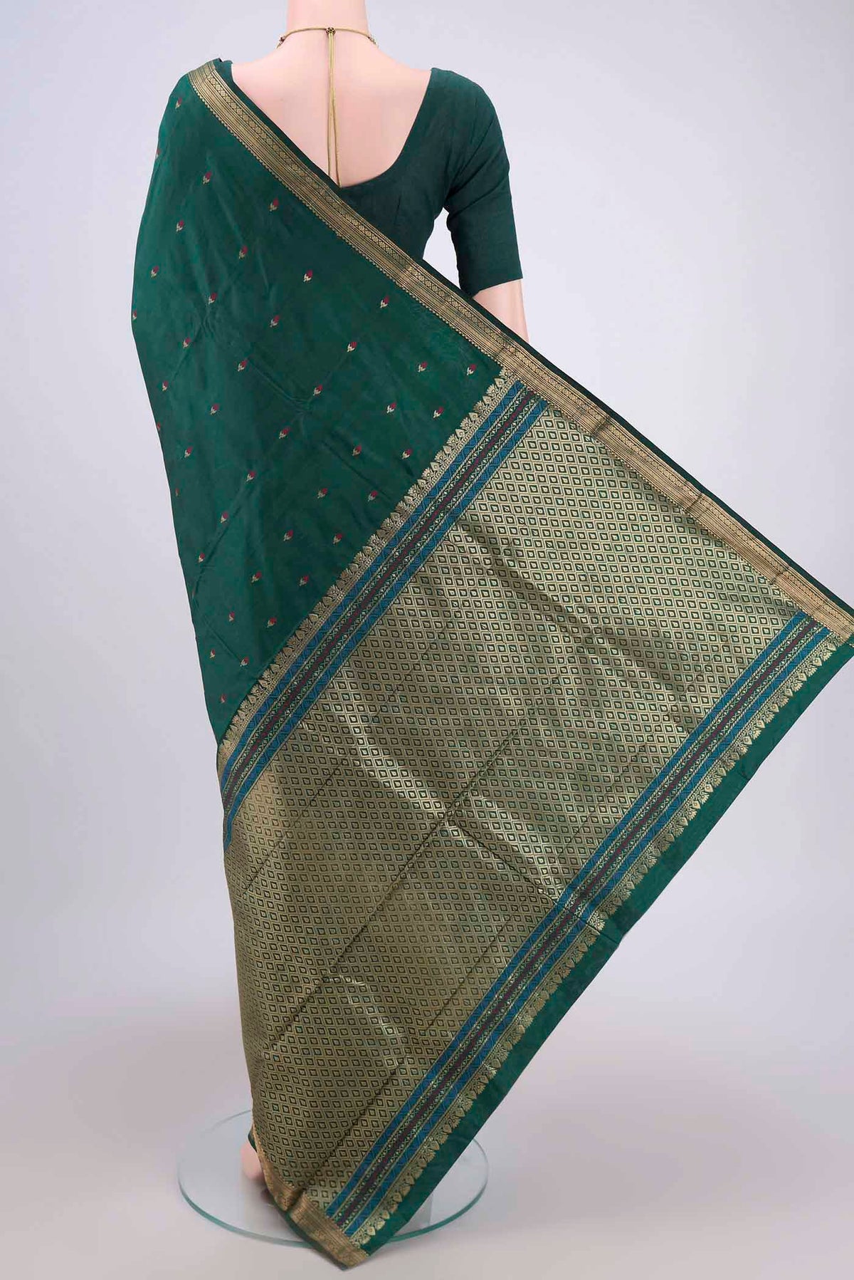 Flat view of Bottle Green Blended Bangalore Silk Saree with Zari And Thread Butta on the body and Zari Border. 
