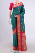 Peacock Blue Blended Bangalore Silk Saree with Zari Butta on the body and Zari Border.  displayed on a mannequin