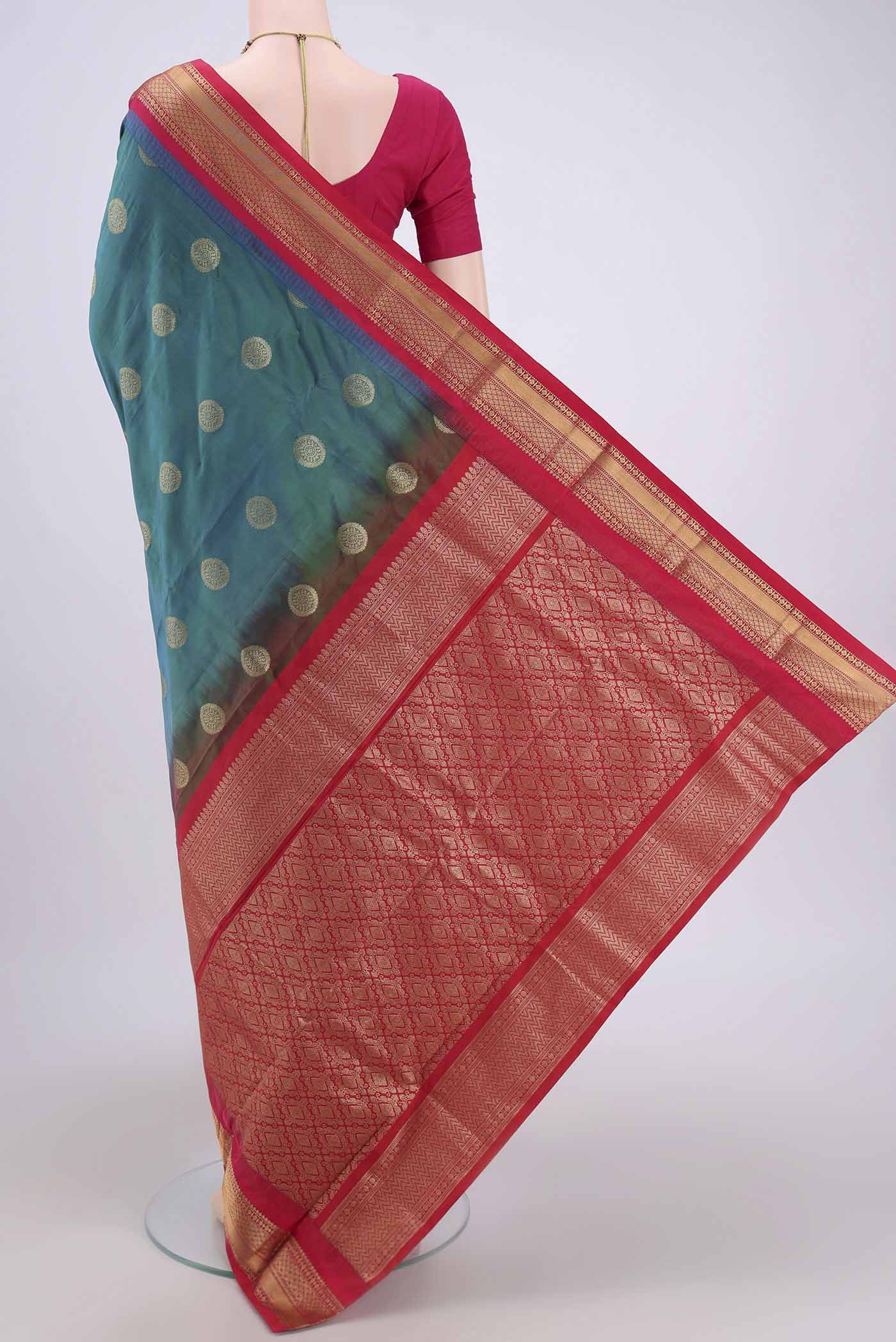 Flat view of Peacock Blue Blended Bangalore Silk Saree with Zari Butta on the body and Zari Border. 
