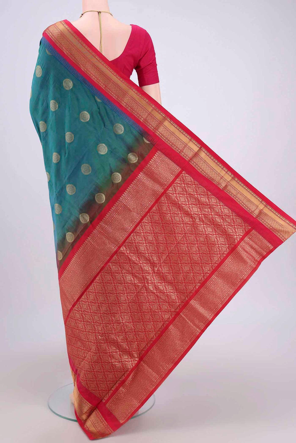 Flat view of Peacock Blue Blended Bangalore Silk Saree with Zari Butta on the body and Zari Border. 